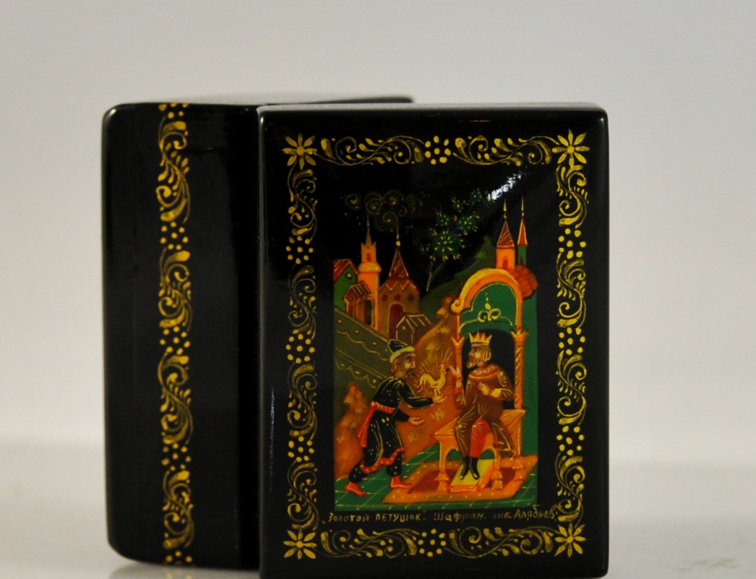 Small Soviet Union lacquered art box. Mint: DESCRIPTION: Small Soviet Union lacquer art box. The lid of box is completely hand painted with folklore scenes. Depiction of a kings servant presenting him with a golden bird. Gold leaf design on all