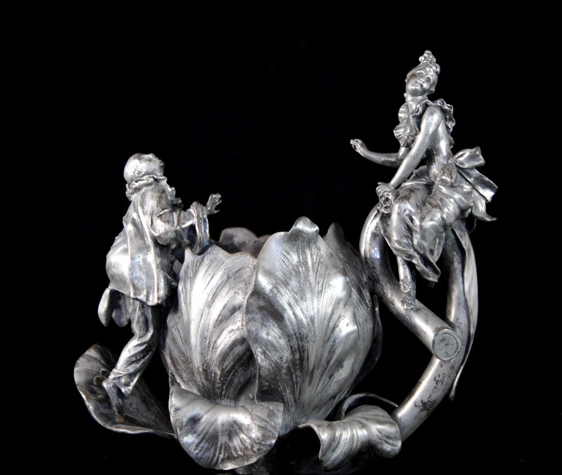 French Art Nouveau "Alfred Jean Foretay" pewter sculptu: DESCRIPTION: French Art Nouveau "Alfred Jean Foretay" pewter sculpture. Gorgeous depiction of Here Pierrot perched on a large flower pedal courting lady Columbine who sits across on the curved flower