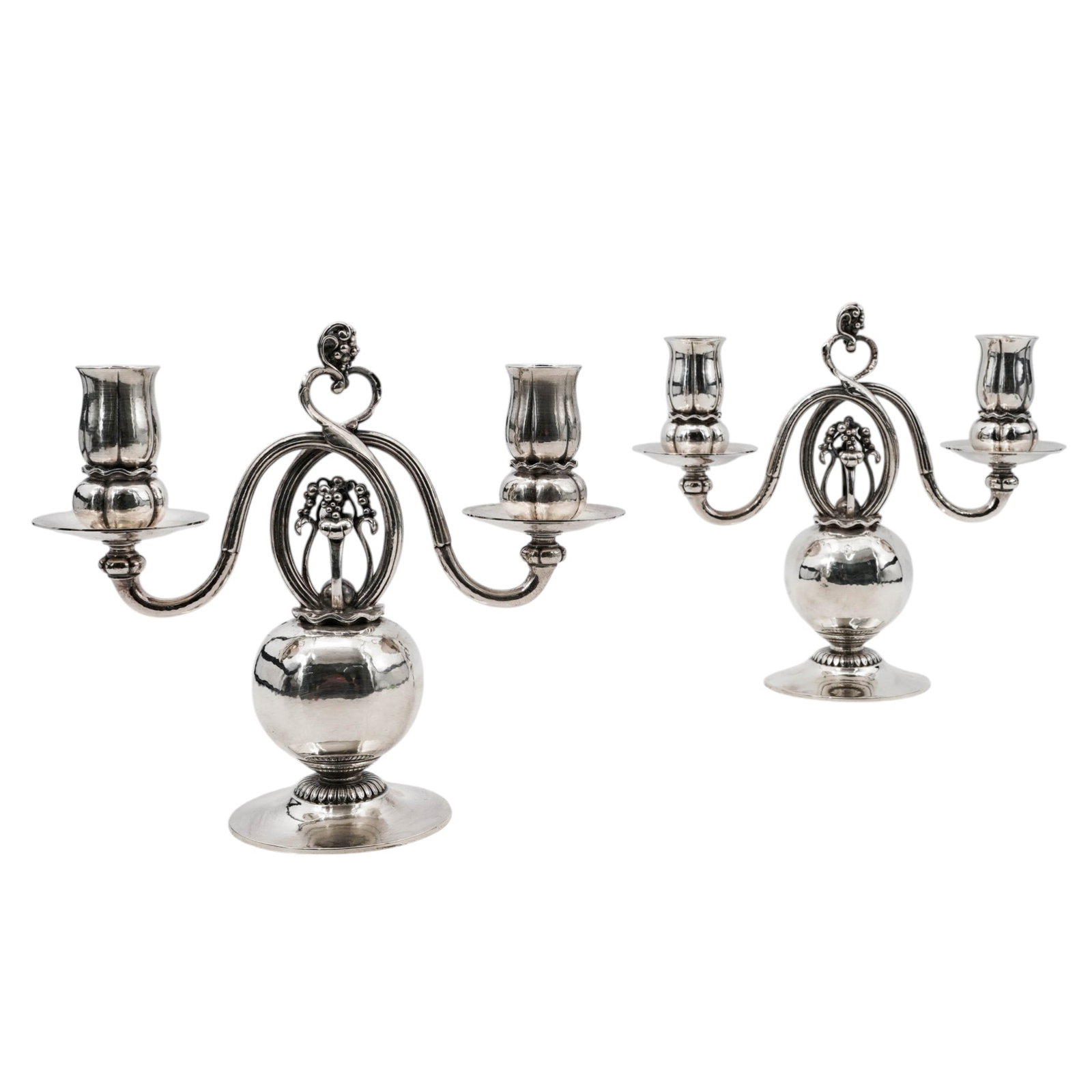 Pair of Georg Jensen Sterling "Pomegranate" Candelabras: Pair of Georg Jensen Sterling "Pomegranate" Candelabras20th century, DanishSterling silver 2-light candelabras that feature a pomegranate-form body with scrolling branch arms and figural elements incl