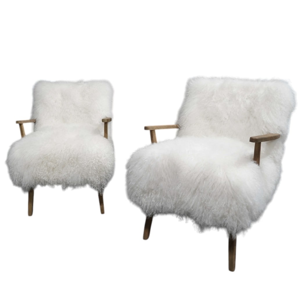 Pair Four Hands Ashland Armchairs: Pair Four Hands Ashland Armchairs20th Cent.Pair of Four Hands Ashland Armchair, featuring shaggy Mongolian cream fur upholstery and sculpted drifted oak arms.H 32" D 31" L 24" Seat H 18.5"