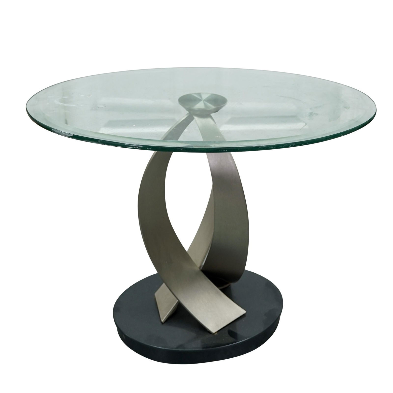 Post Modern Brushed Steel & Glass Table: Post Modern Brushed Steel & Glass TableMid to late 20th centuryA postmodern brushed steel and glass table in the style of designs by Elite Modern.H 22.5" x Base L 15" x W 11" x Top L 27.5" x W 19"