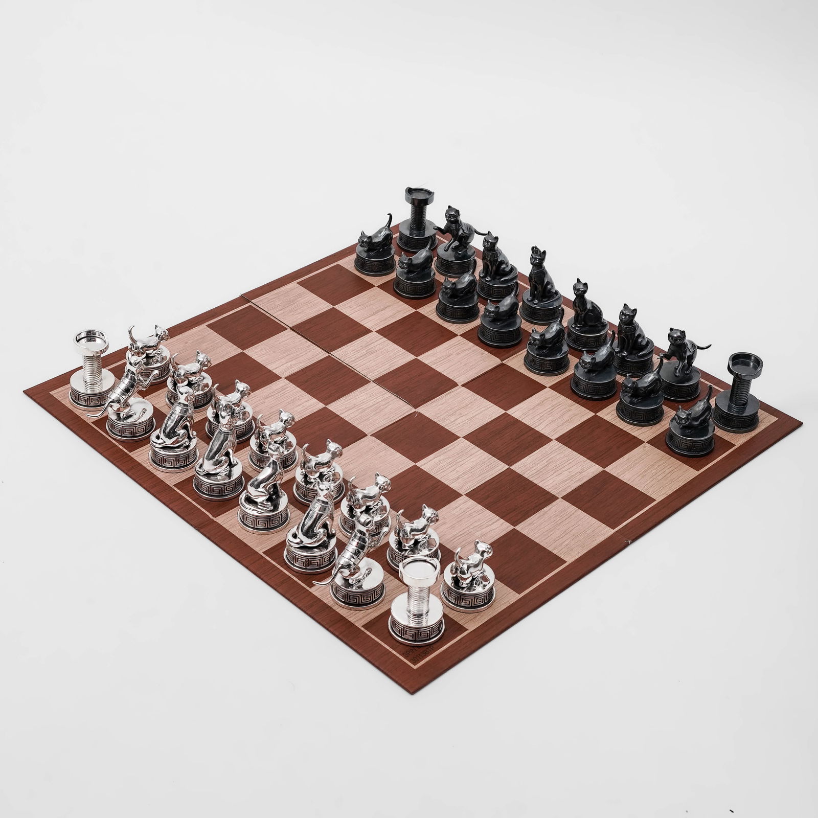 (32 pcs) Italian Bastet Sterling Silver Cat Chess Set: (32 pcs) Italian Bastet Sterling Silver Cat Chess Set20th century, ItalianA thirty-two piece Italian sterling silver chess set, with pieces designed as cats. Diamond and ruby inset eyes. Each piece is