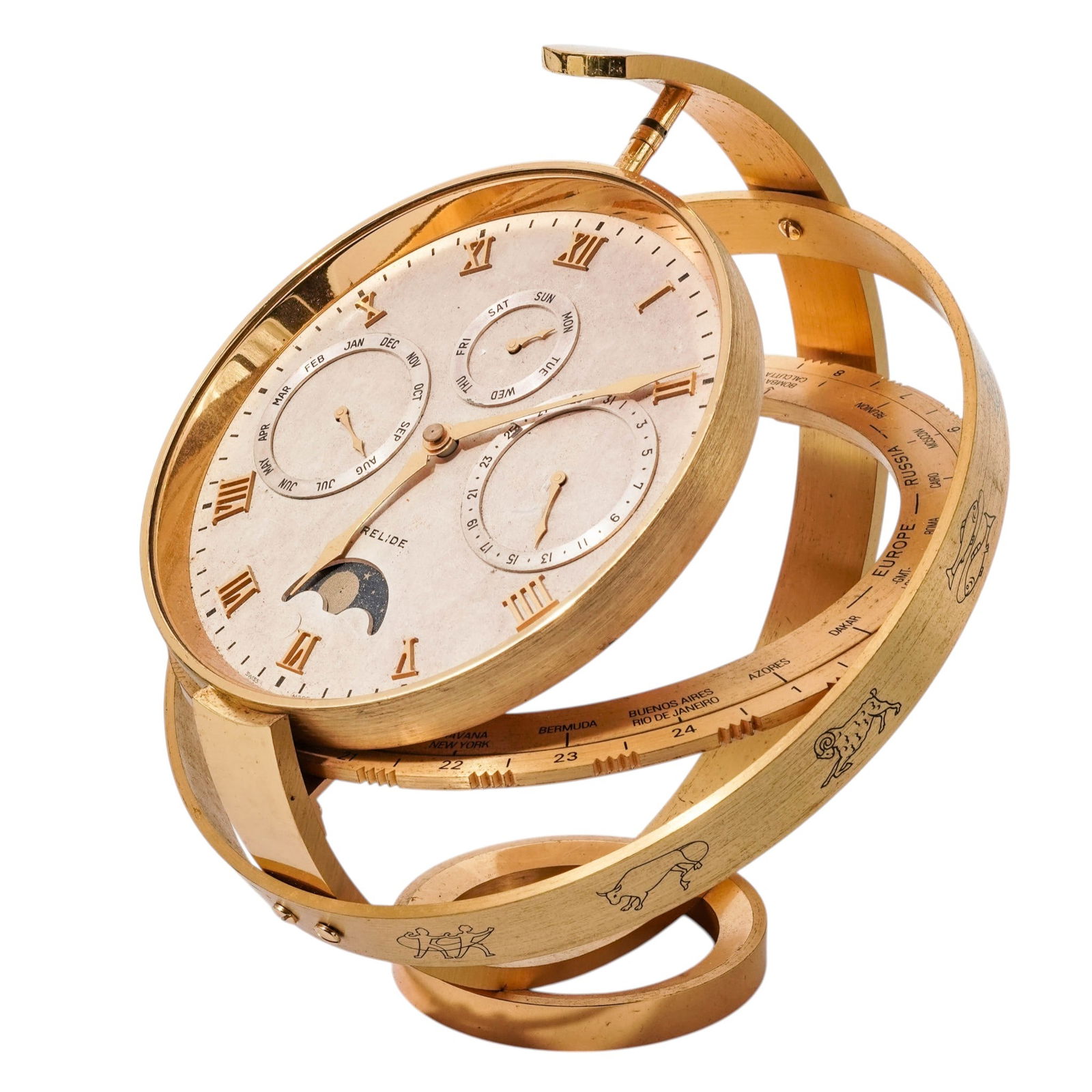 Jean Roulet Le Locle Desk Clock: Jean Roulet Le Locle Desk ClockLate 20th century, SwissJean Roulet Le Locle desk timepiece designed as an armillary sphere or astrolabe, featuring a gilt brass frame adorned with zodiac symbols and an