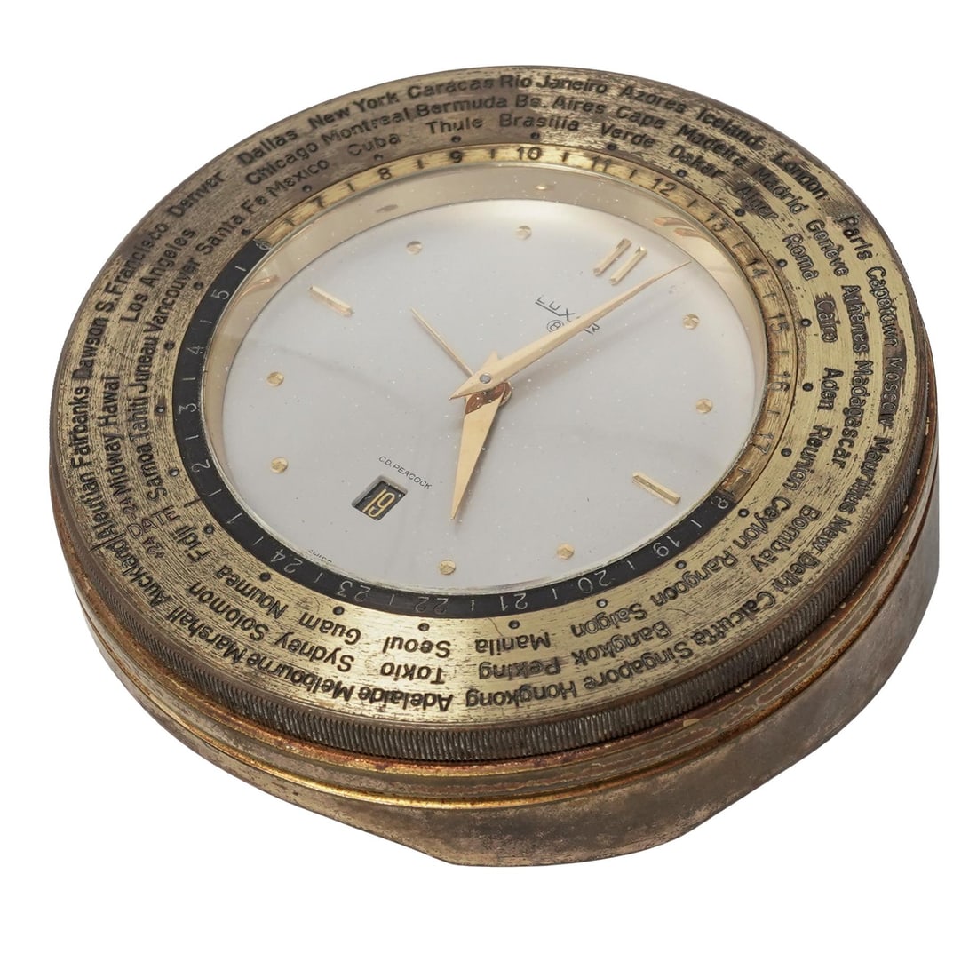 Luxor x CD Peacock 8 Day "World Time" Desk Clock: Luxor x CD Peacock 8 Day "World Time" Desk Clockcirca 1960s-1970s, SwissA Luxor gilt 8 Day "World Time" desk clock. Features a rotating outer ring engraved with international city names representing d