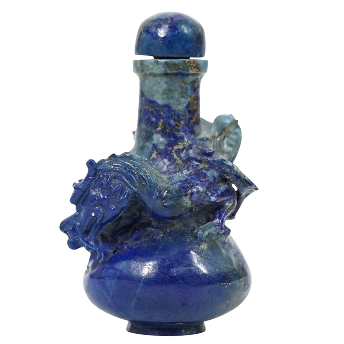 Chinese Carved Lapis Lazuli Snuff Bottle: Chinese Carved Lapis Lazuli Snuff BottleEarly 20th century, ChineseAntique Chinese hand-carved lapis lazuli snuff bottle featuring a highly detailed dragon. It includes the original stopper and spoon.