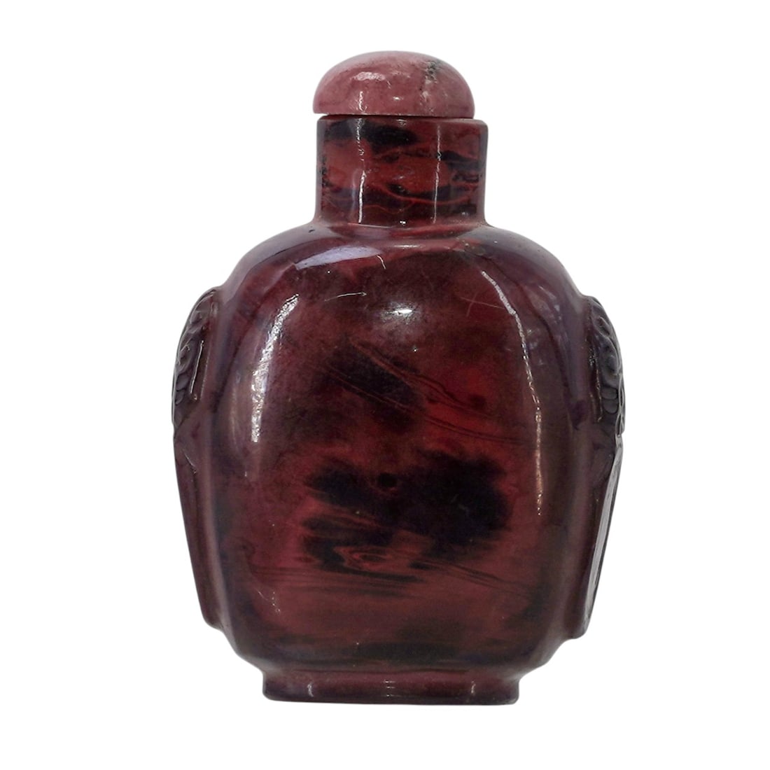 Chinese Carved Agate Snuff Bottle: Chinese Carved Agate Snuff Bottle20th Century, China.Chinese carved agate snuff bottle decorated with carvings on lateral sides depicting the head of guardian lions.H: 2 5/8"