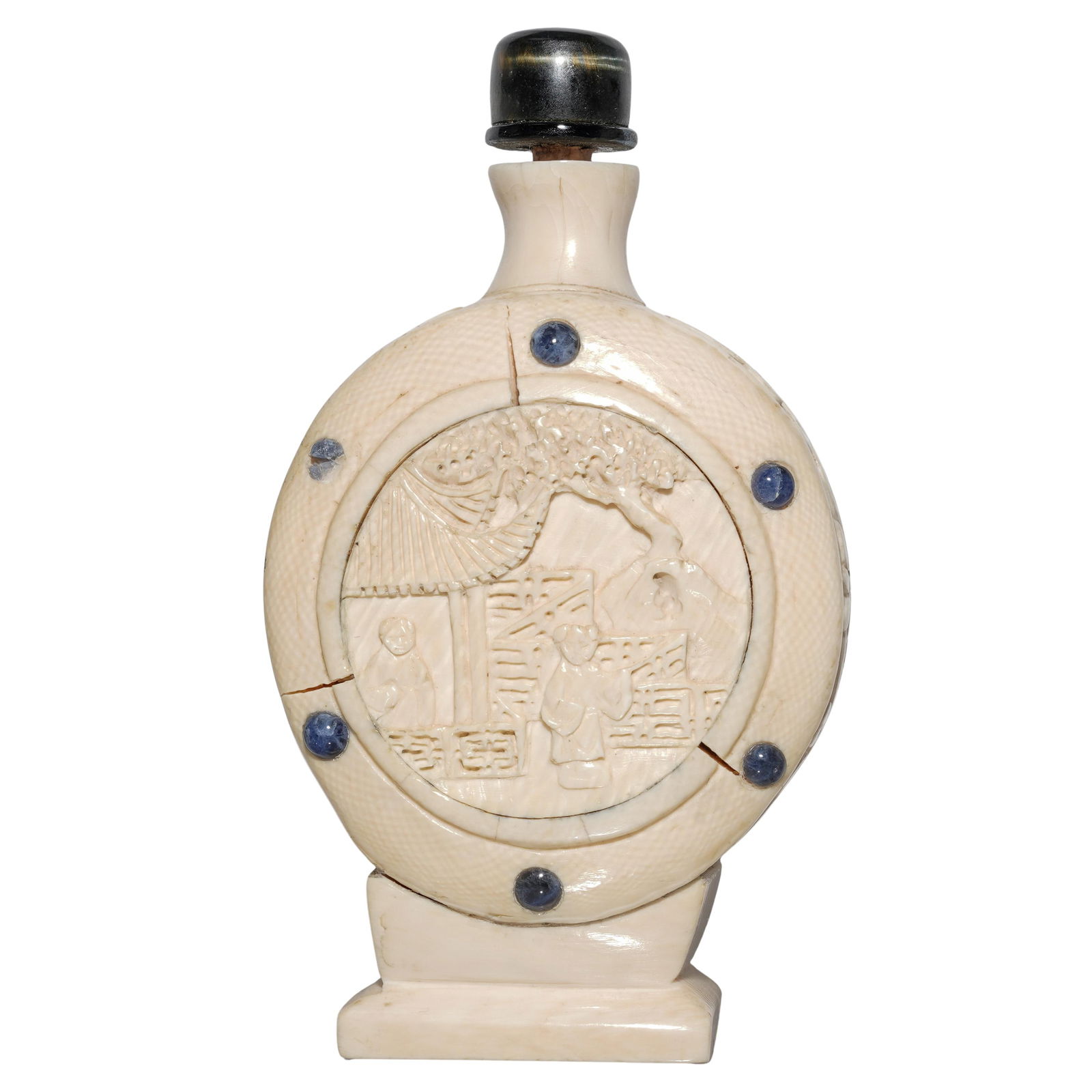 Chinese Carved Bone & Lapis Lazuli Inlaid Snuff Bottle: Chinese Carved Bone & Lapis Lazuli Inlaid Snuff Bottle20th Century, China.Chinese carved bone snuff bottle decorated with intricate central carvings featuring garden figurative scenes, floral carved m