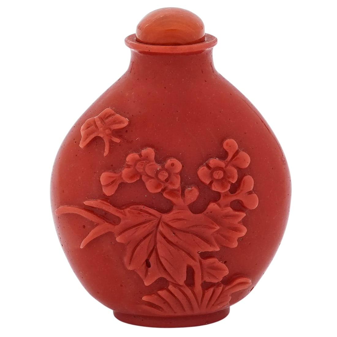 Chinese Peking Glass Snuff Bottle: Chinese Peking Glass Snuff Bottle20th Century, China.Chinese Peking glass snuff bottle resembling carved coral, depicting carved scenes with flowers, a butterfly and dragonfly motifs.H: 3" W: 2 1/8".