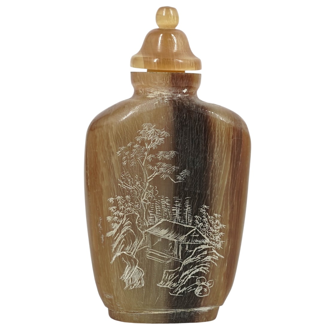 Chinese Carved Horn Snuff Bottle: Chinese Carved Horn Snuff Bottle20th century, ChineseChinese hand-carved horn snuff bottle engraved with a highly detailed landscape scene depicting a house in the forest on on side, and Chinese calli