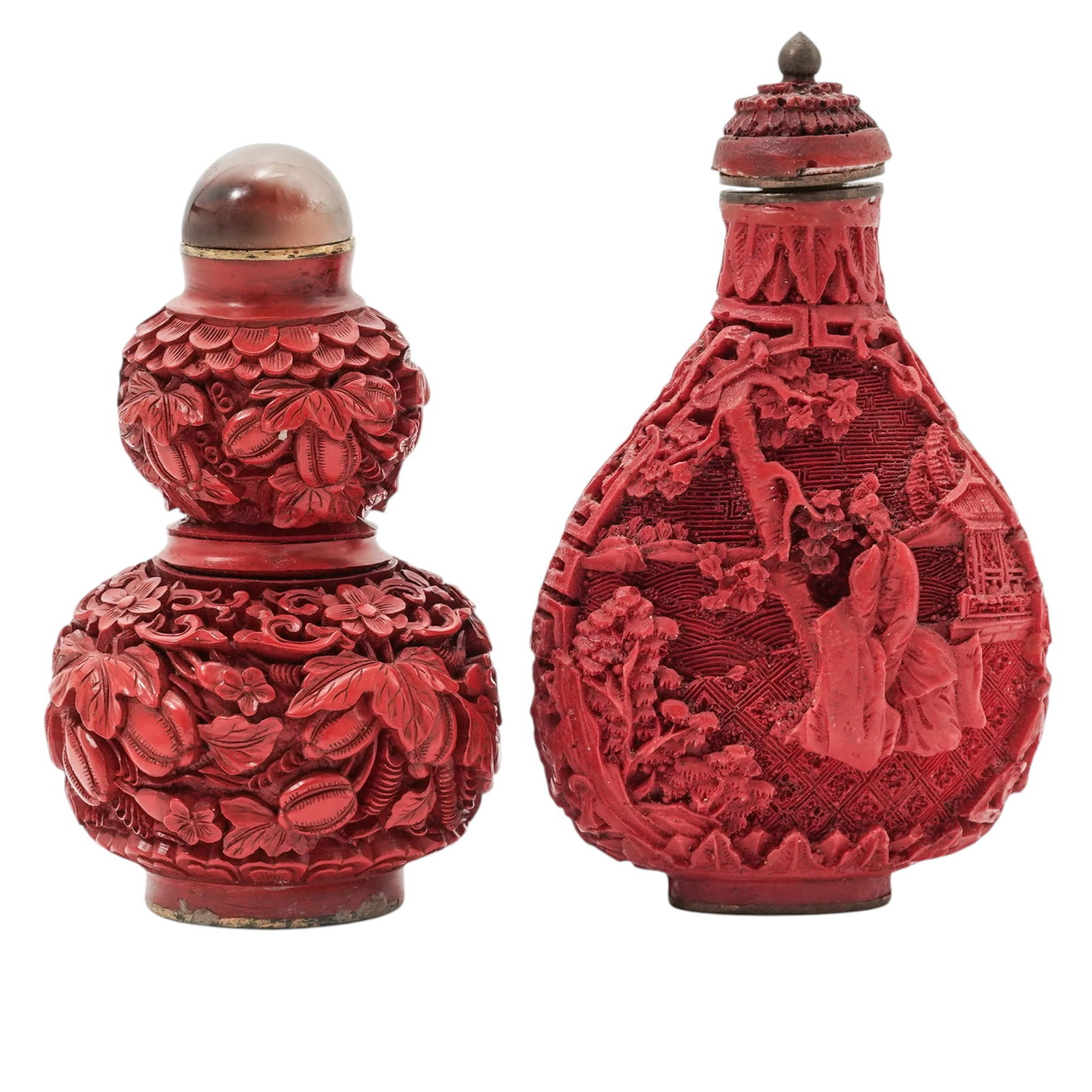 (2 Pc) Chinese Carved Cinnabar Snuff Bottles: (2 Pc) Chinese Carved Cinnabar Snuff Bottles20th century, Chinese(2 Pc) Chinese cinnabar double gourd and landscape snuff bottles, identifiable by their deep red colorant intricate relief carvings. Ci