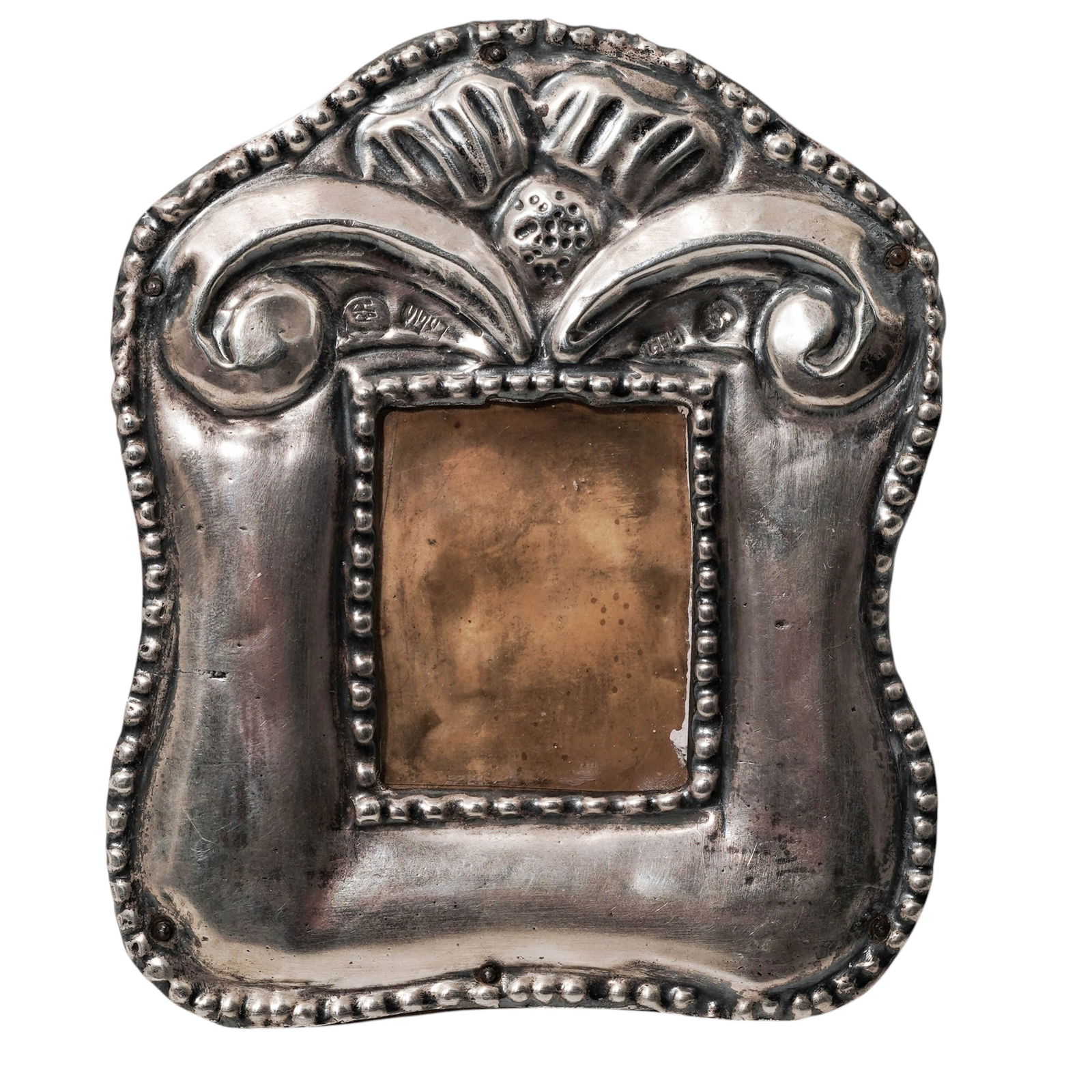 Peruvian Silver Picture Frame: Peruvian Silver Picture FrameEarly 20th century, PeruvianA Peruvian silver picture frame. Marked "R.P." "Peru" with two more illegible hallmarks. Wood backing. Total weight: 73 grams.H 4" x W 3.375"