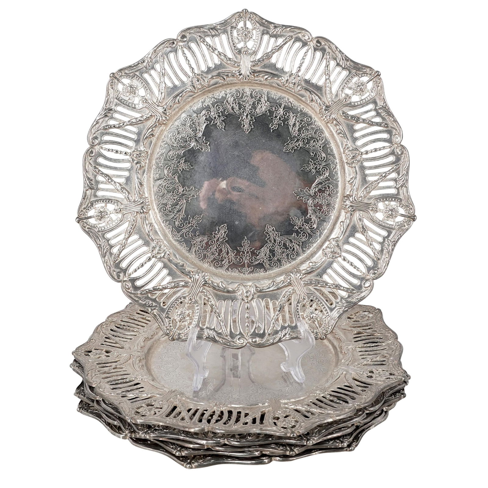 (6 pcs) Antique Silver Plated Charger Plates: (6 pcs) Antique Silver Plated Charger PlatesLate 19th- early 20th century, EuropeanThis charges plates group features a wide, scalloped rim with reticulated (pierced) openwork and high-relief repousse