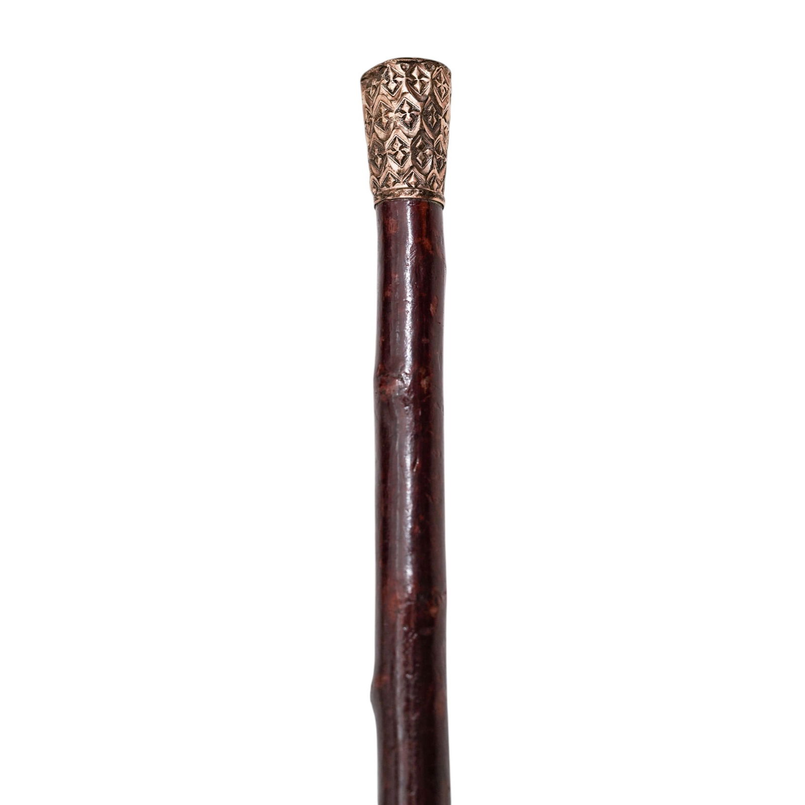 Antique Gilt Wood Walking Stick: Antique Gilt Wood Walking StickEarly 20th centuryAntique walking stick featuring a dark wood shaft and an ornate repousse gilt metal top.L: 28.75" x W: 1"