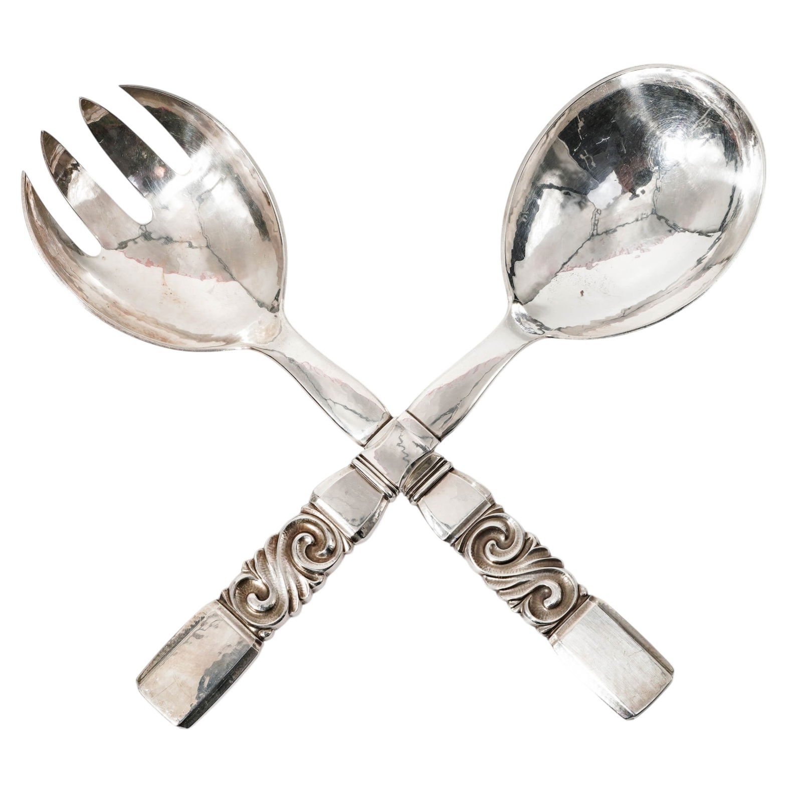 (2 pcs) Georg Jensen Sterling "Scroll" Salad Serving Utensils: (2 pcs) Georg Jensen Sterling "Scroll" Salad Serving UtensilsMid 20th century, DanishSalad serving set crafted from hand-hammered sterling silver and feature a distinctive swirling, ornate handle. The