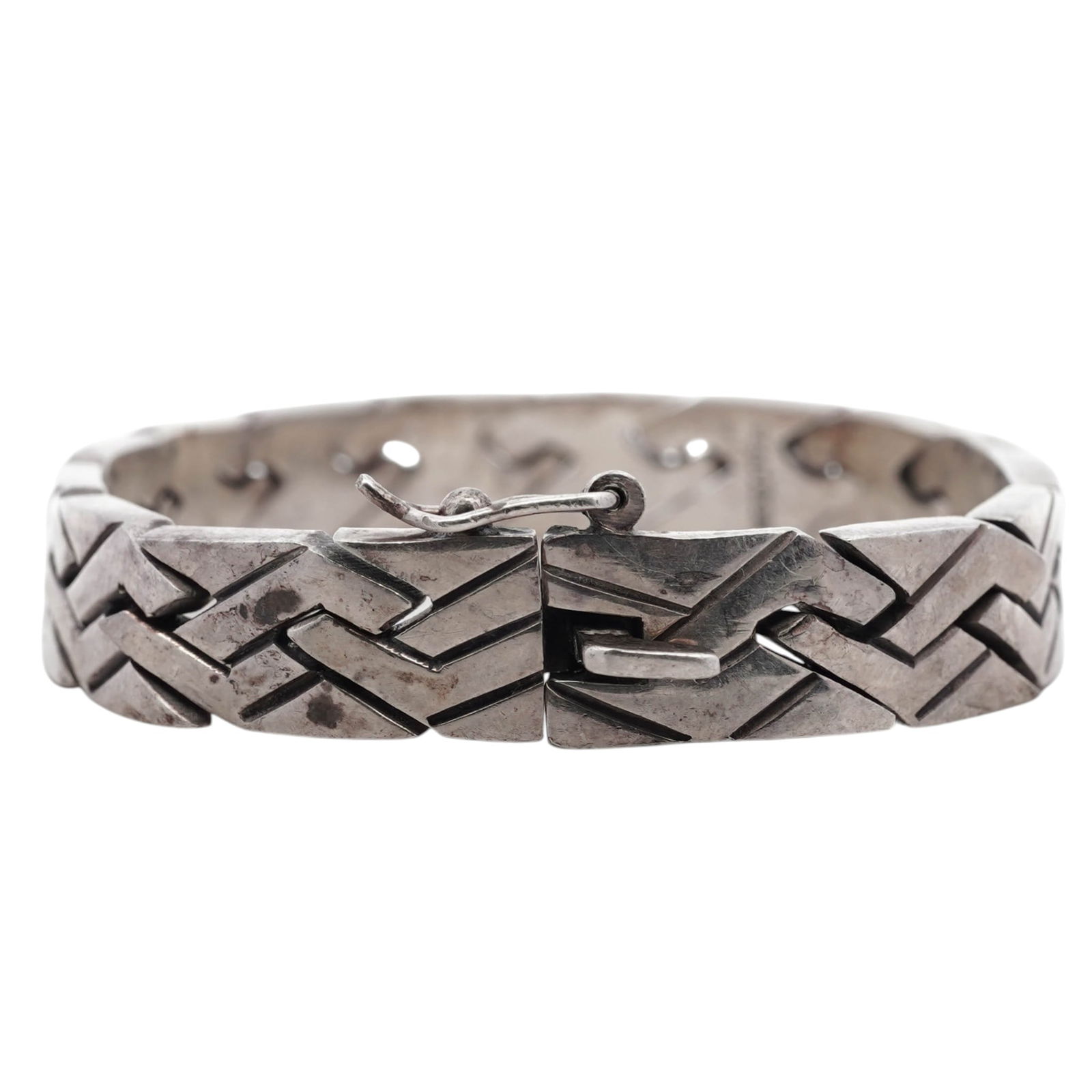 Mexican Sterling Silver Modernist Bracelet: Mexican Sterling Silver Modernist Bracelet1980s–1990s, MexicoMexican sterling silver link bracelet composed of articulated geometric links forming a continuous zigzag pattern. Integrated box clasp w