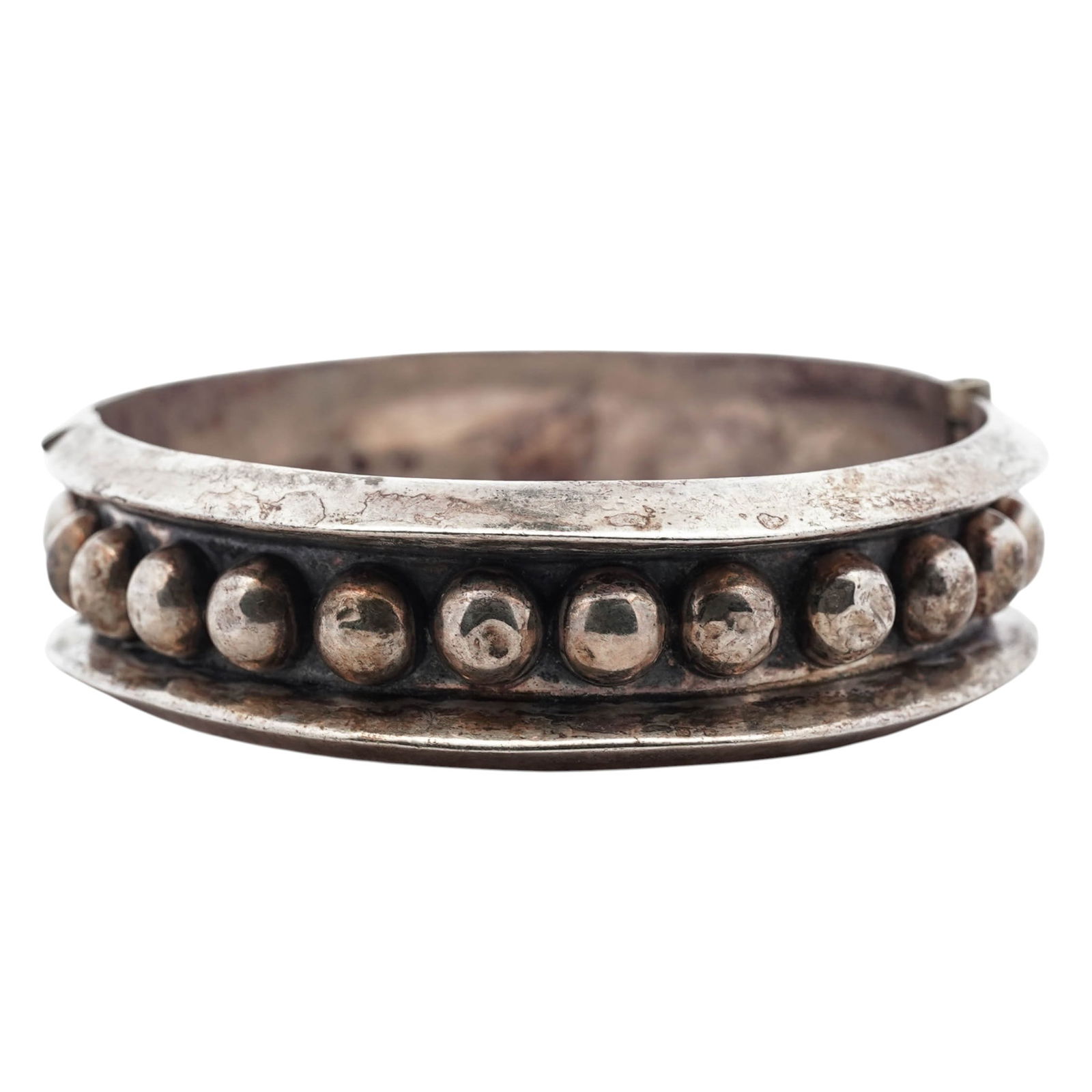 Vintage Mexican Sterling Silver Hinged Cuff Bracelet, Signed: Vintage Mexican Sterling Silver Hinged Cuff Bracelet, Signed1960s-1970s, MexicoVintage sterling silver hinged cuff bracelet of bold construction, centered by a raised band of applied hemispherical bos