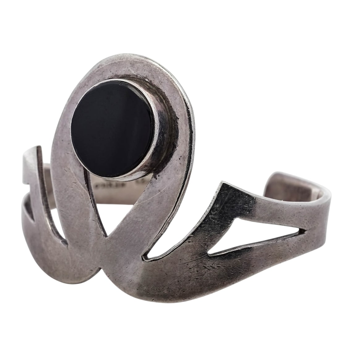 Vintage Mexican Sterling Silver & Onyx Modernist Cuff Bracelet: Vintage Mexican Sterling Silver & Onyx Modernist Cuff Bracelet1960s-1970s, MexicoModernist open cuff bracelet of sculptural sterling silver construction, centered with a circular black onyx measuring