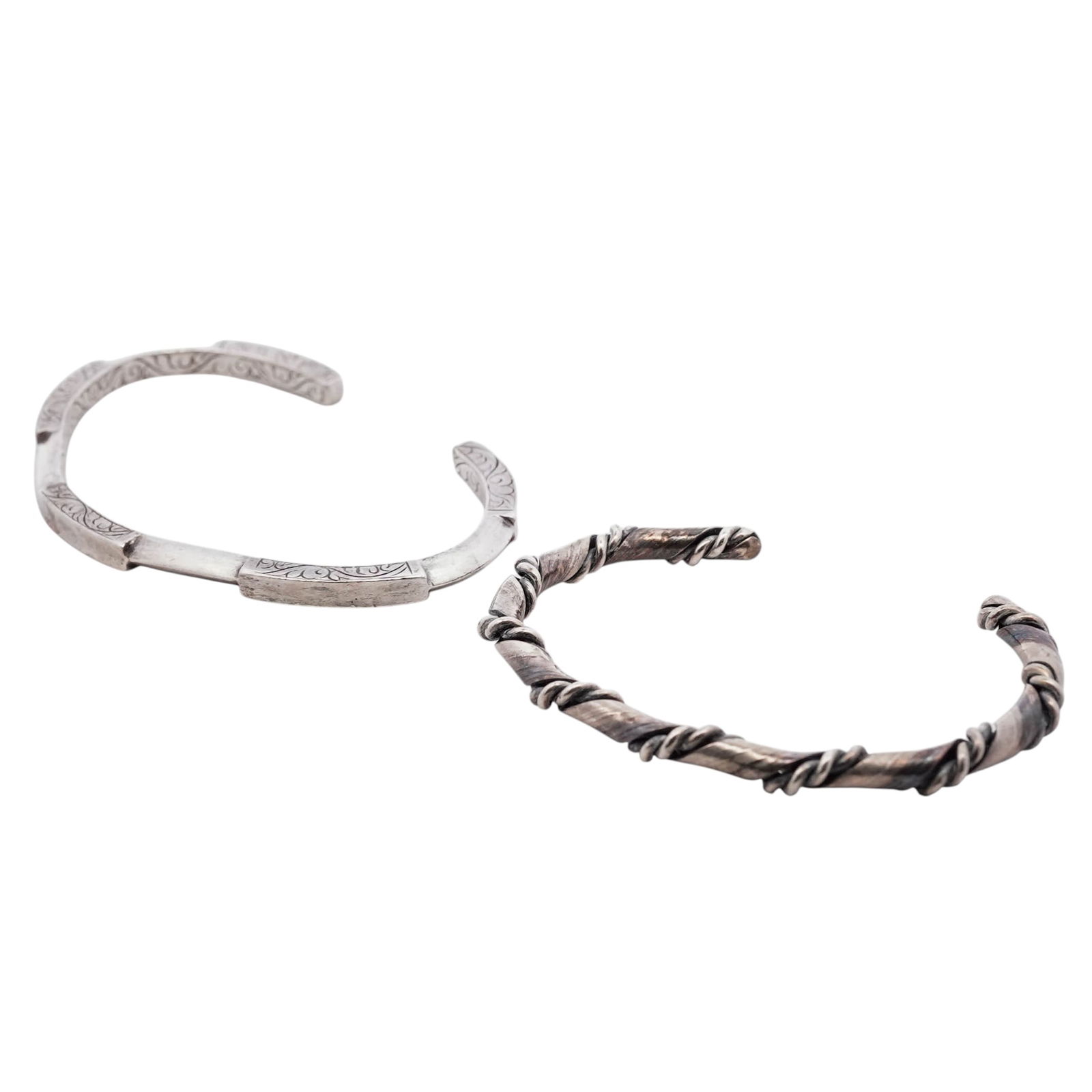 (2 Pcs) Mexican Sterling Silver Cuff Bracelets: (2 Pcs) Mexican Sterling Silver Cuff Bracelets1980s–1990s, MexicoSet of two Mexican sterling silver cuff bracelets. One of twisted rope-form construction with applied wire wraps. The other of flat b