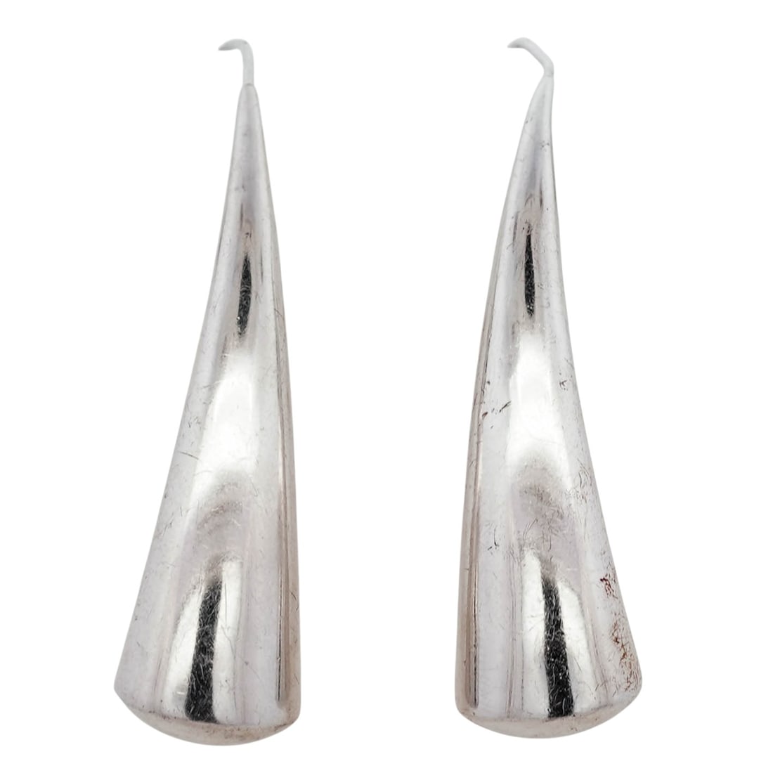 Vintage Peruvian Sterling Silver Sculptural Drop Earrings Signed: Vintage Peruvian Sterling Silver Sculptural Drop Earrings Signed1970s-1980s, PeruPair of elongated sculptural drop earrings in sterling silver, each formed as a tapered, gently curved drop with a poli
