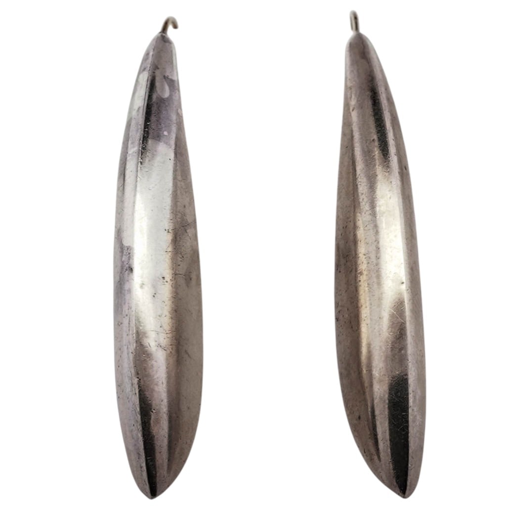 Vintage Sterling Silver & 14k Gold Drop Earrings: Vintage Sterling Silver & 14k Gold Drop EarringsLate 20th CenturyVintage sculptural sterling silver drop earrings with elongated tapered hollow forms, each suspended from 14K gold ear wires. Smooth hi