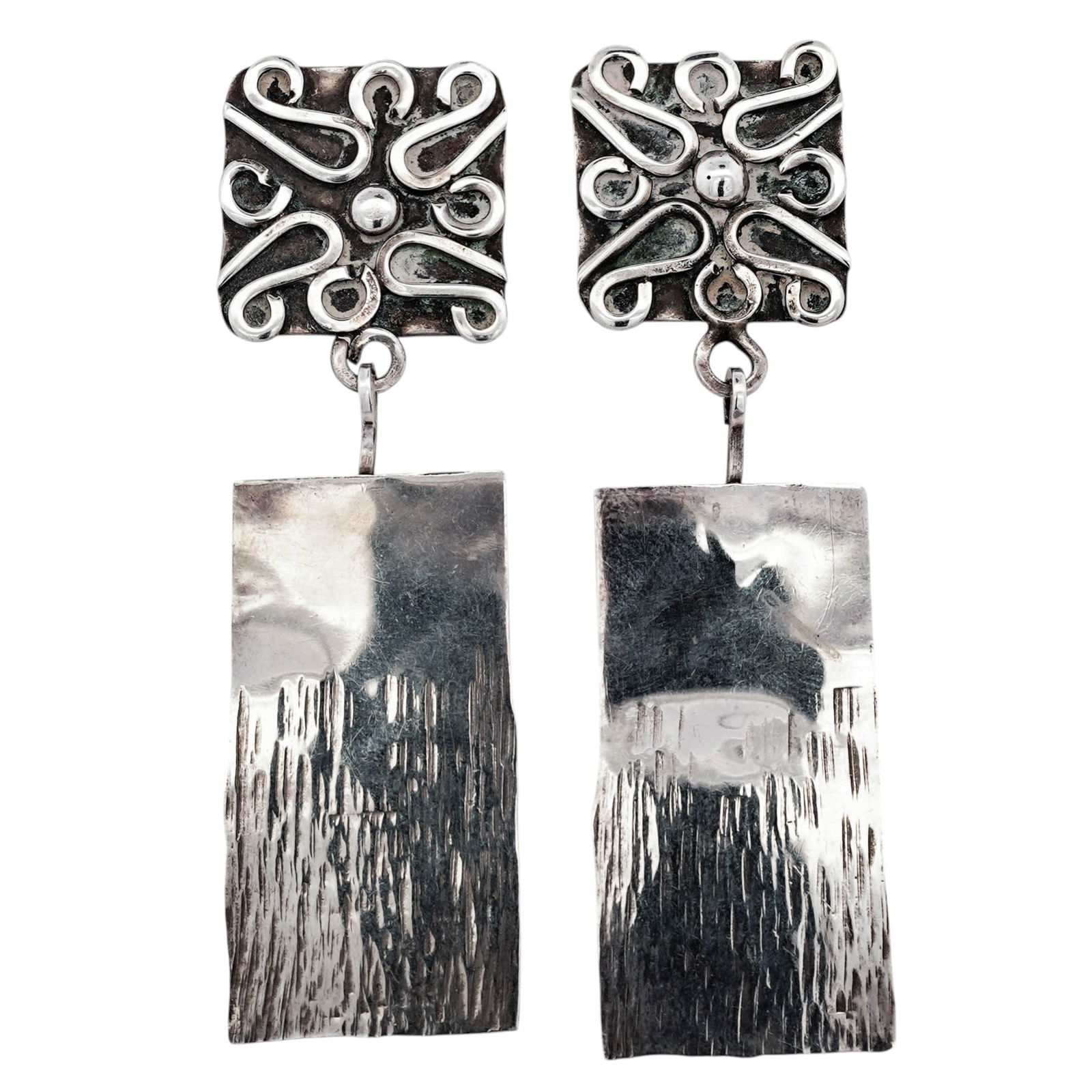 Modernist Sterling Silver Dangle Earrings Signed: Modernist Sterling Silver Dangle Earrings SignedDated 1991Sterling silver dangle earrings composed of square upper plaques decorated with applied scrollwire motifs centered by a raised bead, suspendin