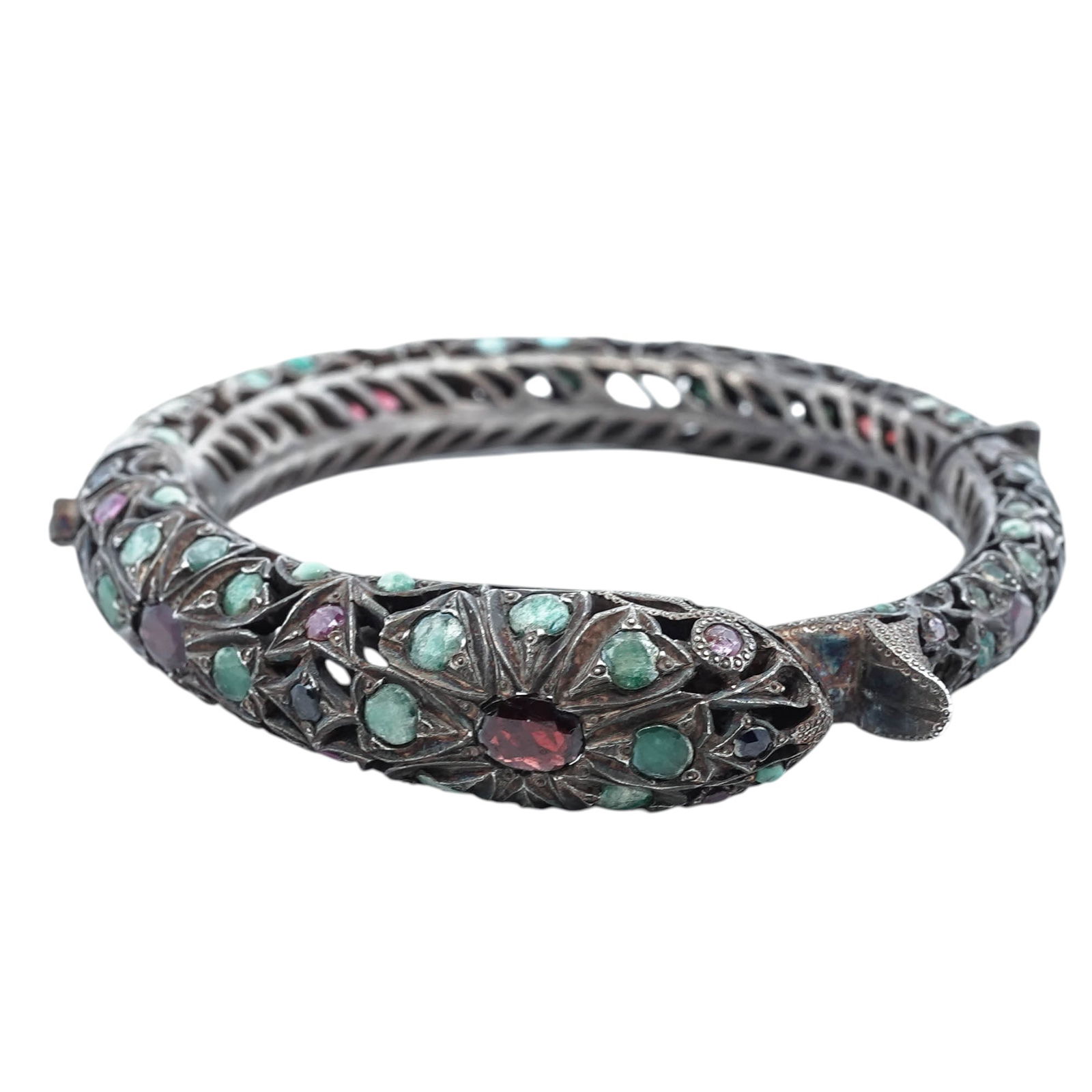 Indian Mughal-Style Silver Gem-Set Hinged Bracelet: Indian Mughal-Style Silver Gem-Set Hinged BraceletLate 19th–early 20th century, IndiaHeavy hinged silver bracelet of Mughal-inspired design, finely worked with pierced foliate and geometric openwork