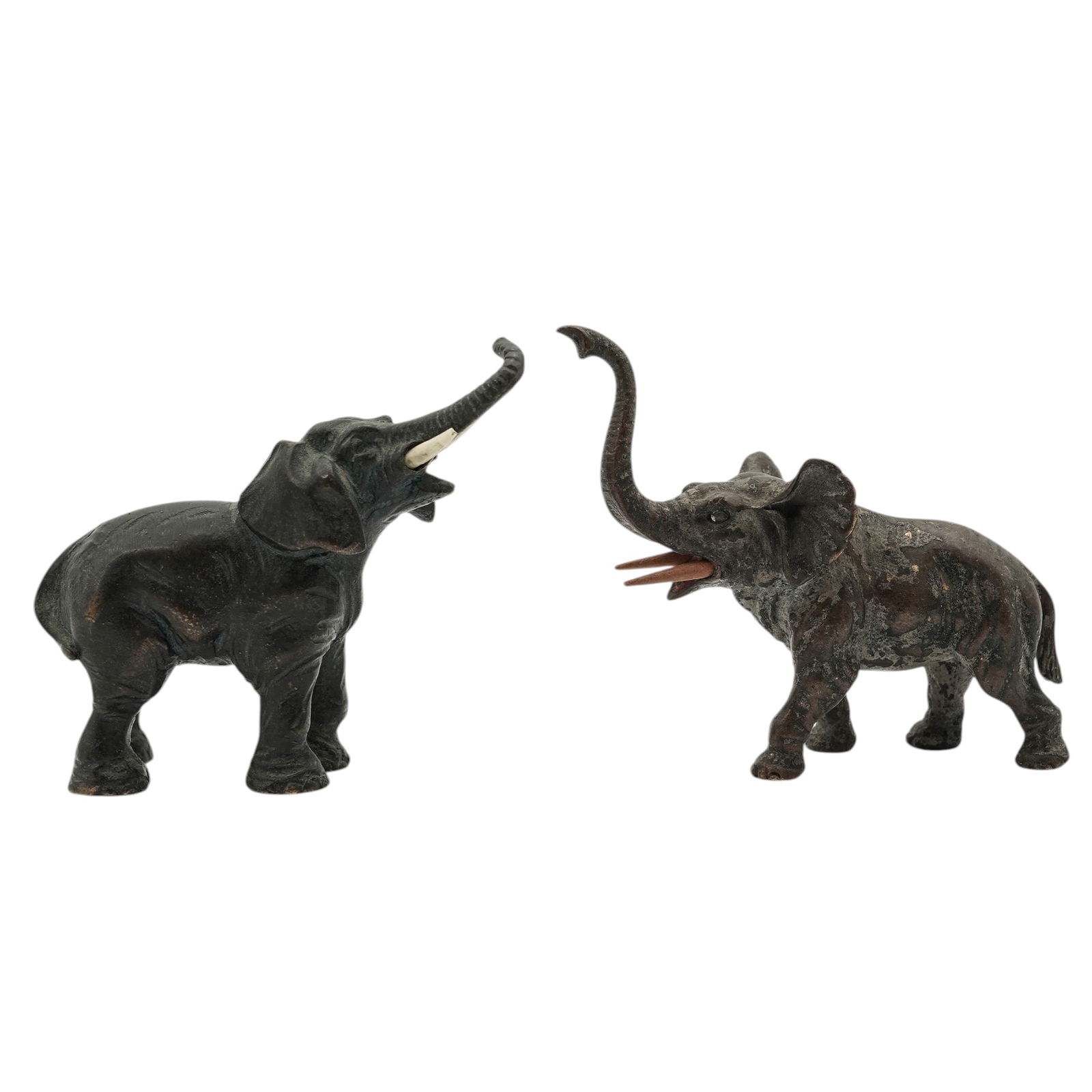 (2 pcs) Patinated & Vienna Bronze Elephant Figurines: (2 pcs) Patinated & Vienna Bronze Elephant FigurinesLate 19th- early 20th century, Austrian, ContinentalTwo antique bronze figurines depicting elephants with raised trunks. One was crafted in the trad