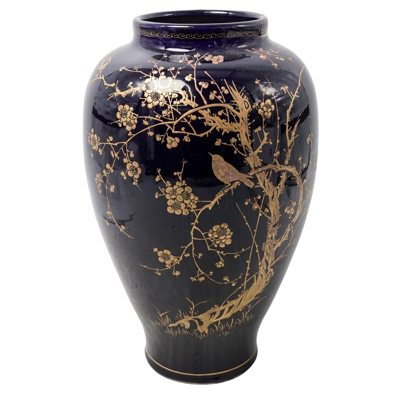 Chinoiserie Gilt Cobalt Porcelain Vase: Chinoiserie Gilt Cobalt Porcelain VaseMid- late 20th centuryCobalt blue crackle-glazed porcelain vase featuring gilt chinoiserie decorations of birds and cherry blossoms.H: 14.25"