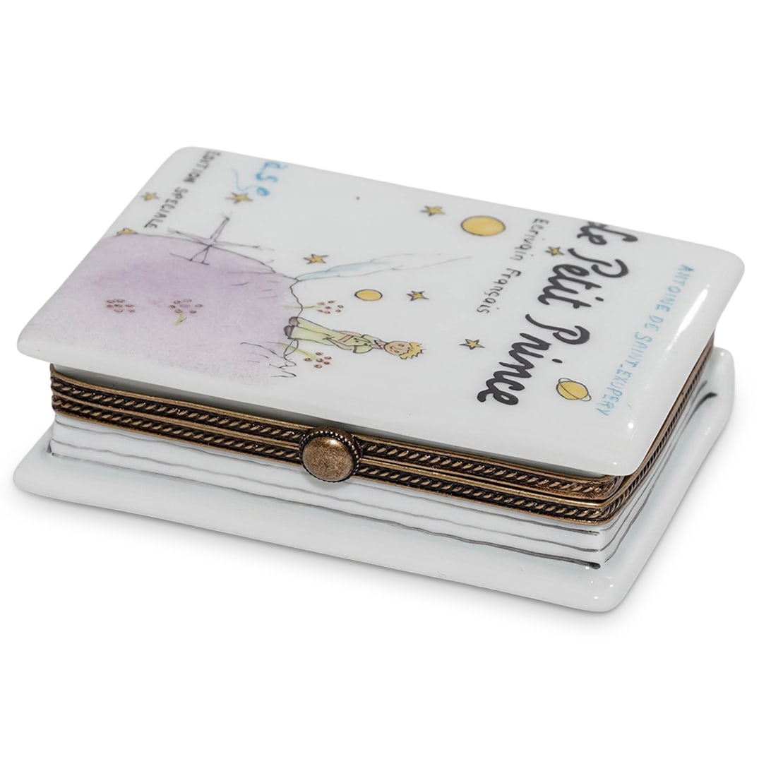 Limoges Porcelain 'The Little Prince Book' Trinket Box: Limoges Porcelain 'The Little Prince Book' Trinket Box20th Century, France.Limoges porcelain 'The Little Prince Book' trinket box. Signed on the interior "Peint main Limoges'.H: 3 1/4" W: 2 3/8".