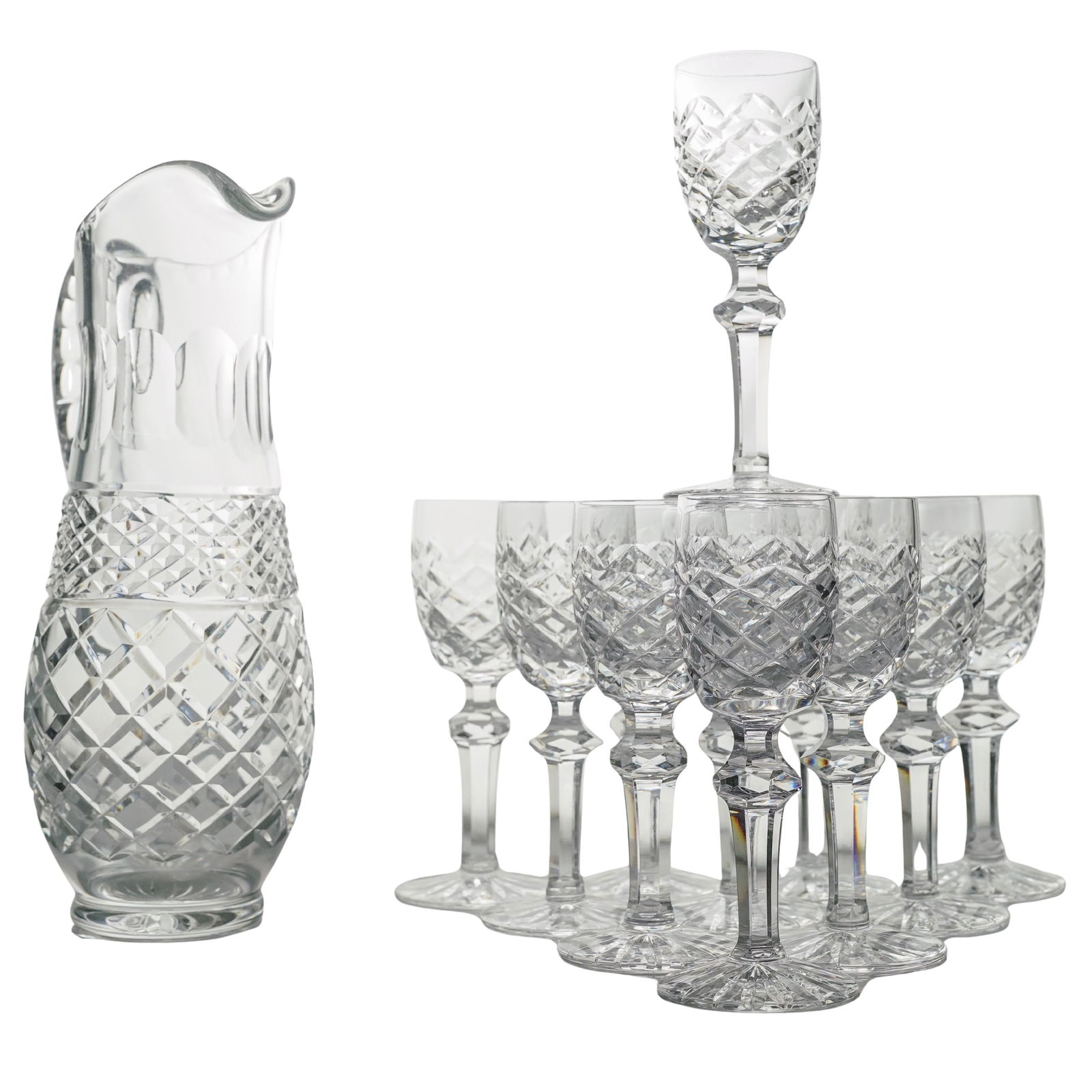 (12 pcs) Vintage Crystal Pitcher & Cordial Glasses Set: (12 pcs) Vintage Crystal Pitcher & Cordial Glasses Set20th centuryThis is a vintage crystal cordial set featuring a classic diamond-cut pattern on the lower bowls and bases. The set displays an elegan