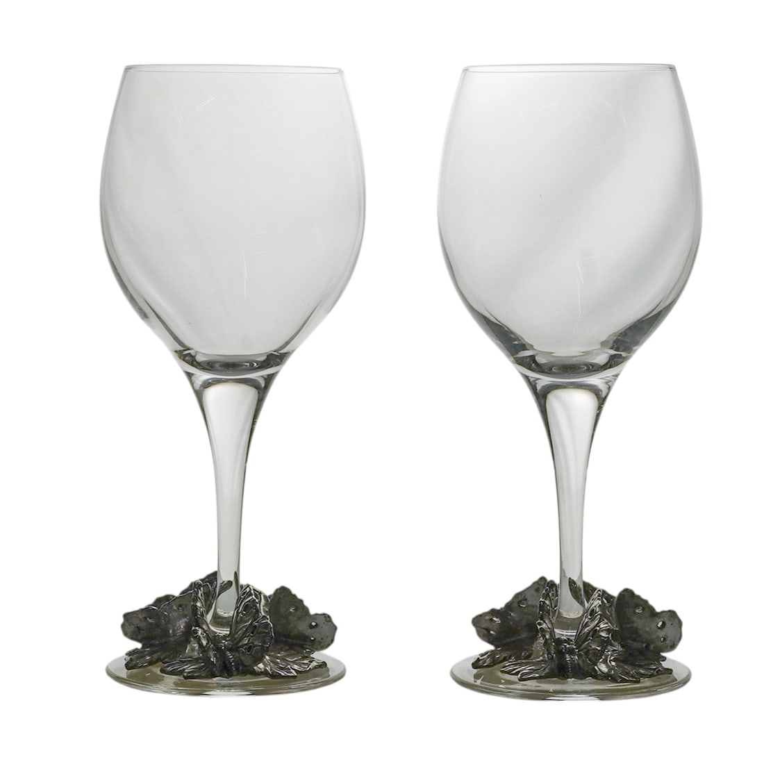 Pair of ARC Crystal & Metal Wine Glasses: Pair of ARC Crystal & Metal Wine Glasses20th century, FrenchThese wine glasses feature a clear glass bowls set into ornate, sand-cast pewter bases. The design is defined by a nature-inspired relief mo