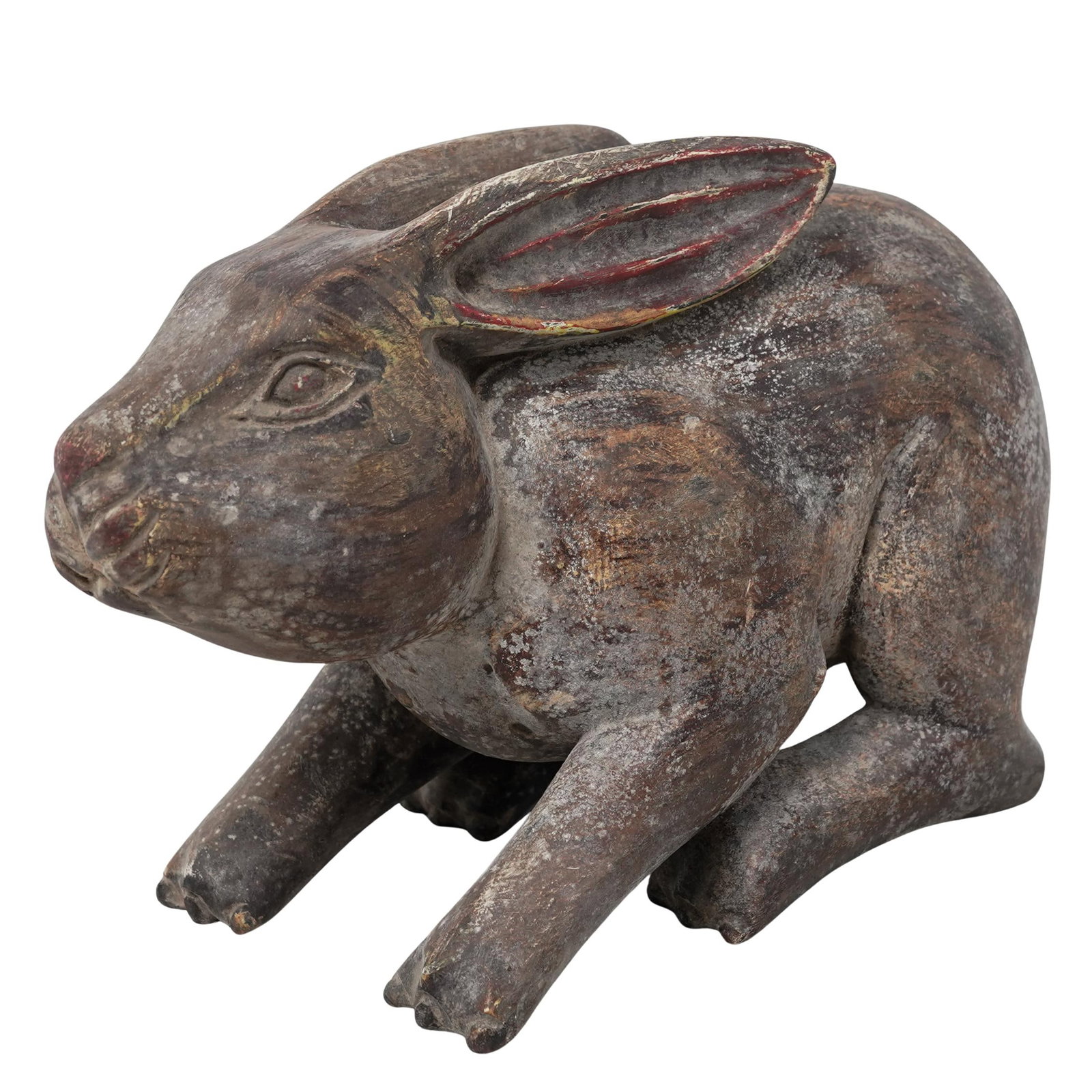 Vintage Carved Wood Rabbit Figurine: Vintage Carved Wood Rabbit FigurineMid 20th century, South AmericanVintage polychrome hand-carved wooden rabbit. The sculpture features a rustic, blocky form characteristic of traditional Latin Americ