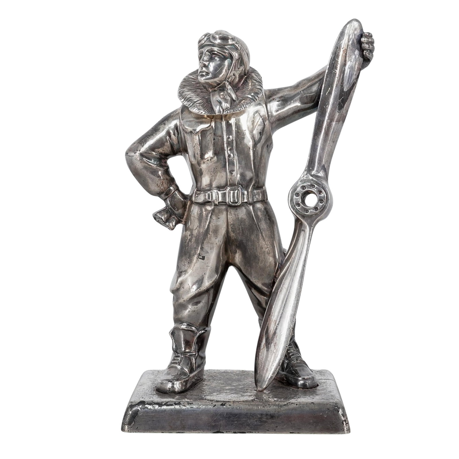 Art Deco Metal Plated Figural Pilot Table Lighter: Art Deco Metal Plated Figural Pilot Table Lighter1930sThis table lighter is cast in silver-plated spelter, depicting a pilot in period-accurate Sidcot-style flying gear, including a fur-lined collar,