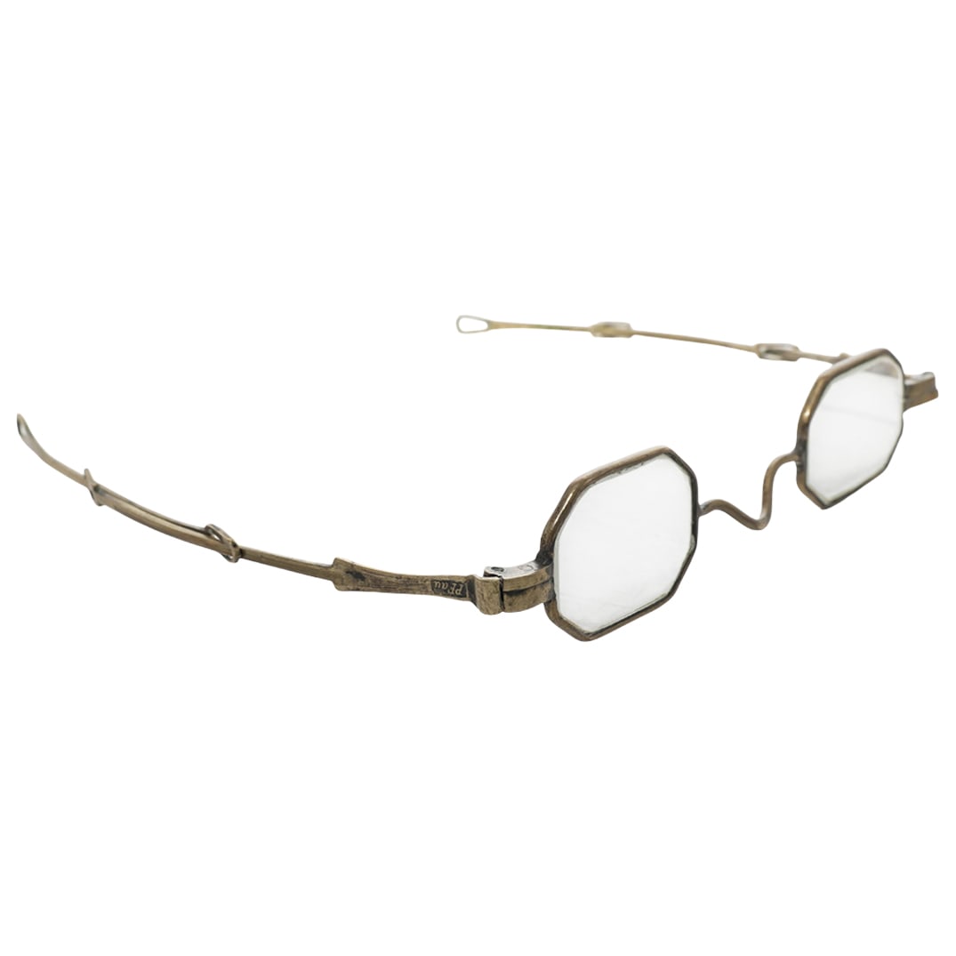 Antique Gilt Spectacles & Cases: Antique Gilt Spectacles & CasesLate 19th-early 20th centuryA pair of antique spectacles in a gilt brass tone and marked "PFau" on arms. Includes two cases.Spectacles L (lenses): 4.5" x W (arms): 5"Cas