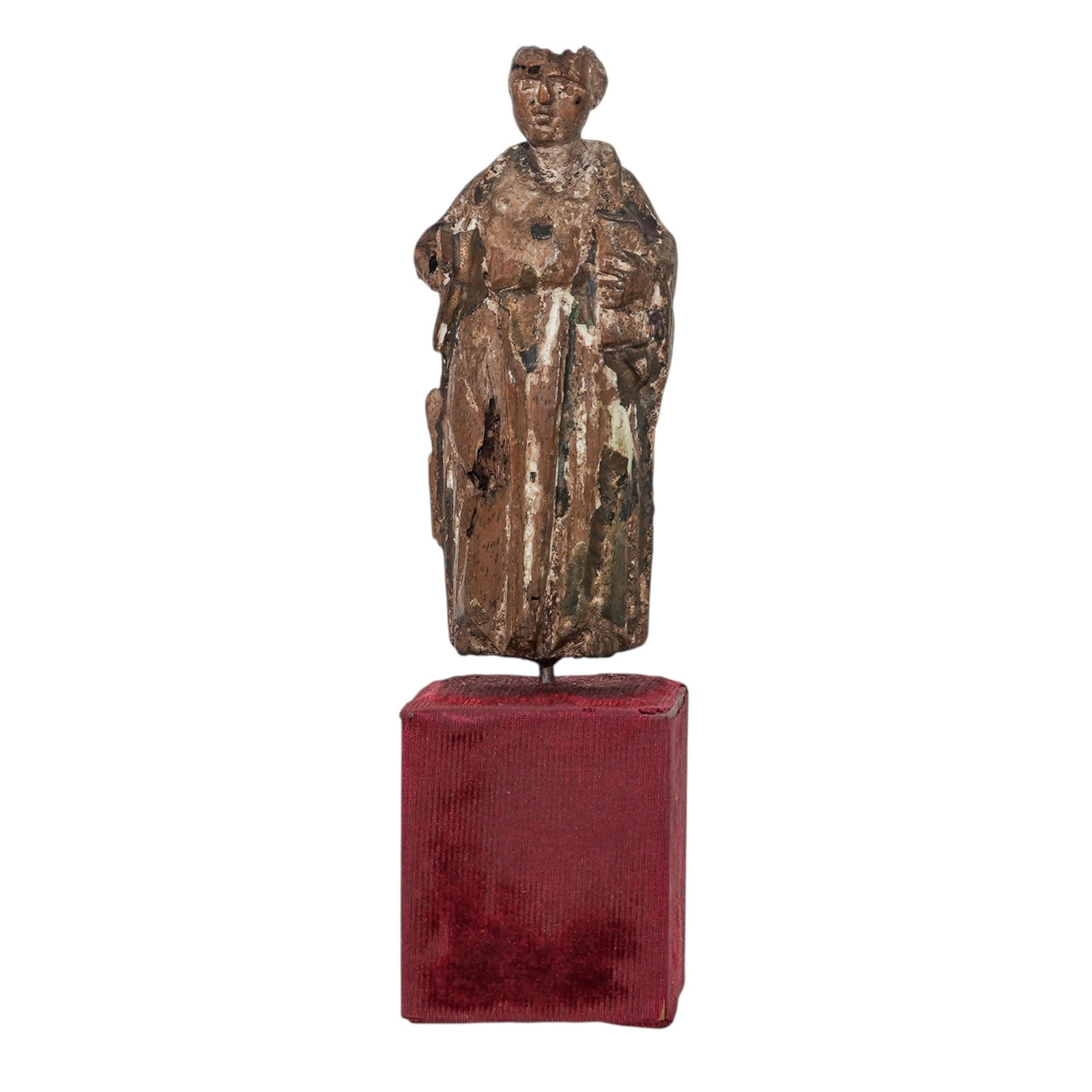 Antique Wooden Santos Figure: Antique Wooden Santos Figure17th- 18th century, EuropeanHand-carved wood religious Santos statue with remnants of white gesso, gilding, and polychrome paint. It is mounted on a red fabric-covered wood