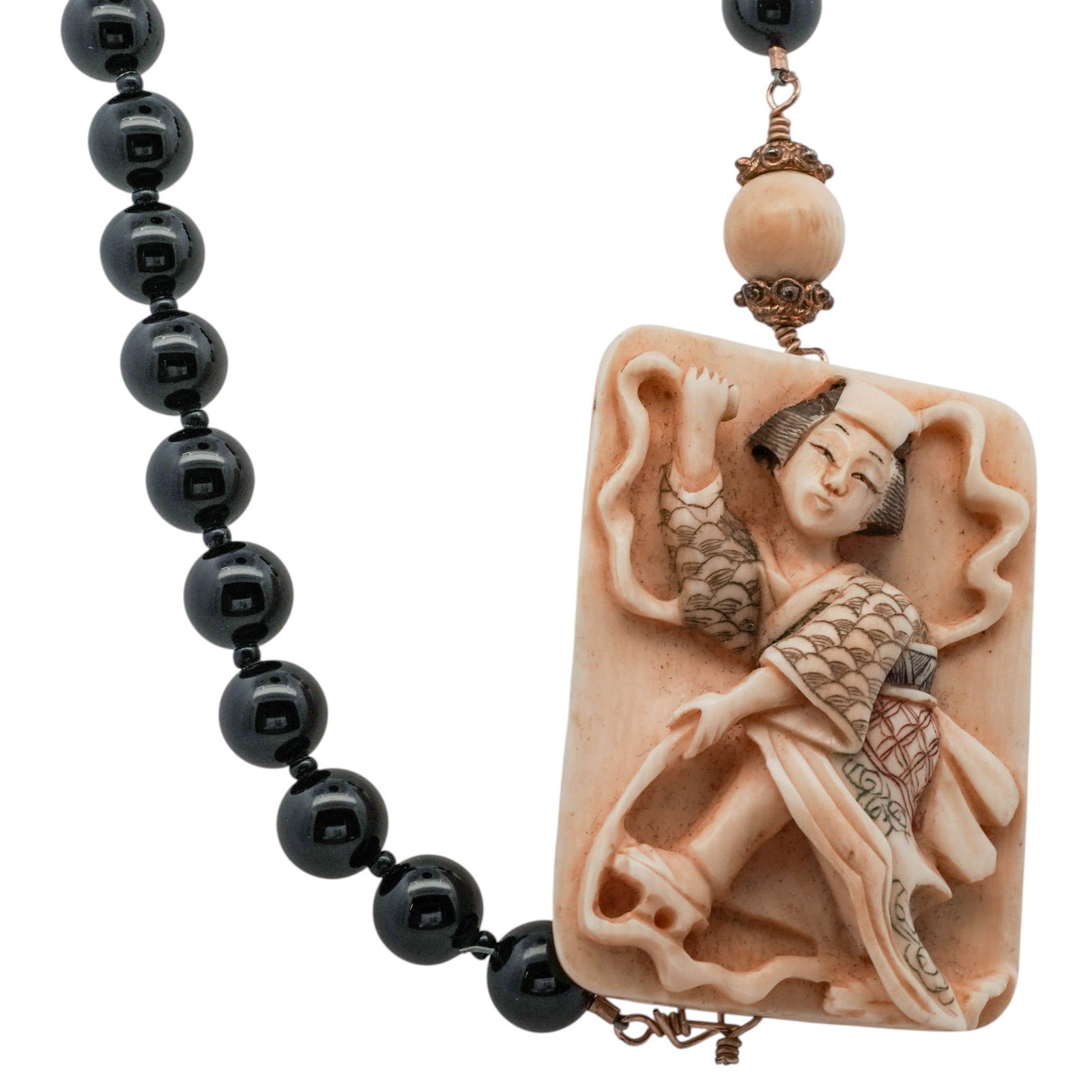 Chinese Xi Shi Longevity Carved Bone & Onyx Necklace: Chinese Xi Shi Longevity Carved Bone & Onyx NecklaceEarly 20th century, ChineseA Chinese carved bone and onyx beaded necklace with a large hand-painted carved bone depiction of a beautiful woman, poss