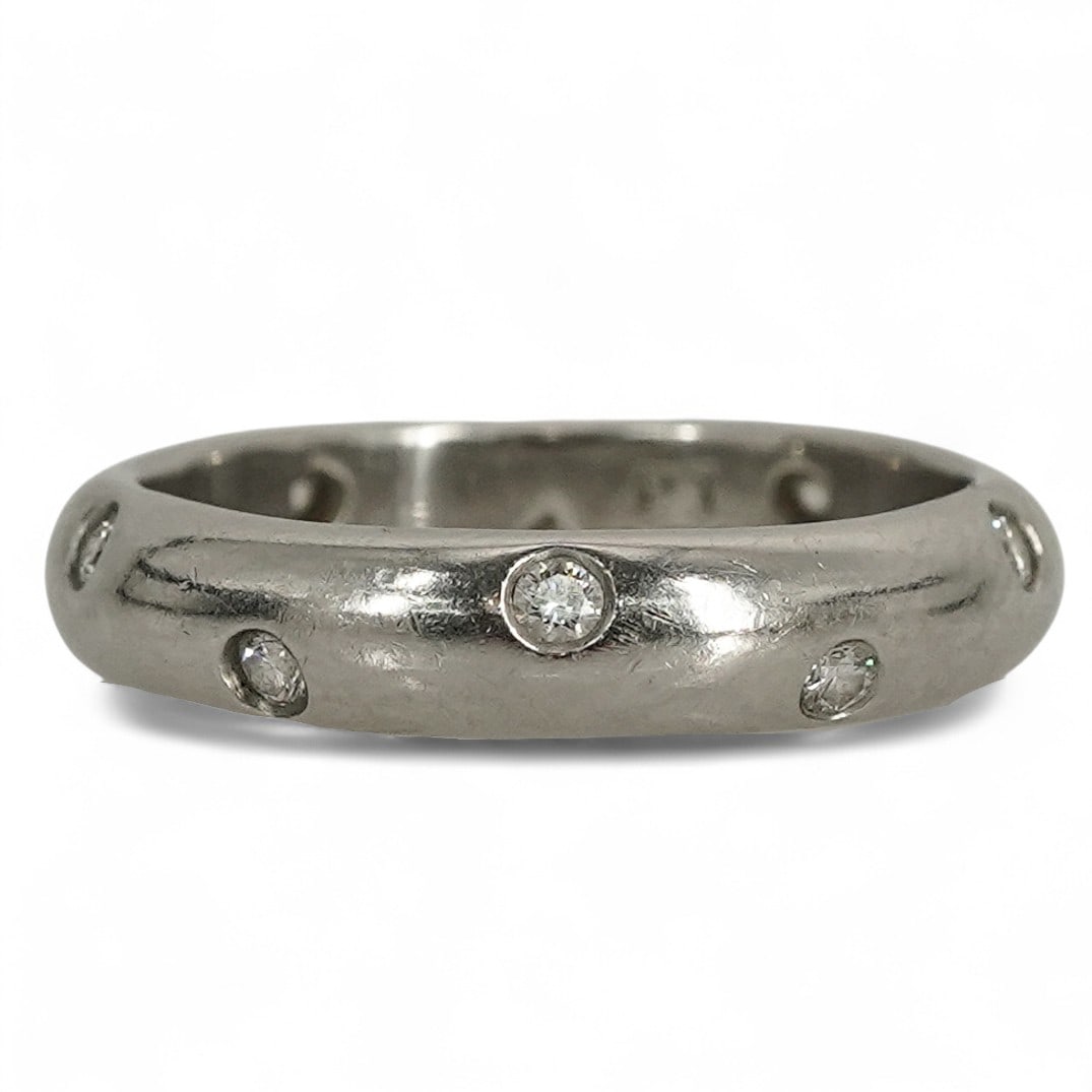 Tiffany & Co. Etoile Platinum & Diamond Band Ring: Tiffany & Co. Etoile Platinum & Diamond Band Ring 1990s-2000s, USA Tiffany & Co. Etoile band ring in platinum 950 with domed comfort-fit profile and bezel-set round brilliant diamonds spaced around th