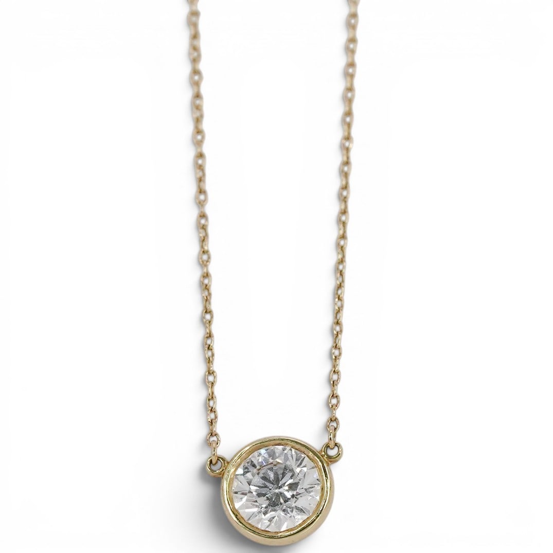 Elsa Peretti for Tiffany & Co. 18k Gold & Diamond "Diamonds by the Yard" Necklace: Elsa Peretti for Tiffany & Co. 18k Gold & Diamond "Diamonds by the Yard" Necklace 1990s, USA 18k yellow gold diamond solitaire pendant necklace by Elsa Peretti for Tiffany & Co., set with a 1.08 carat