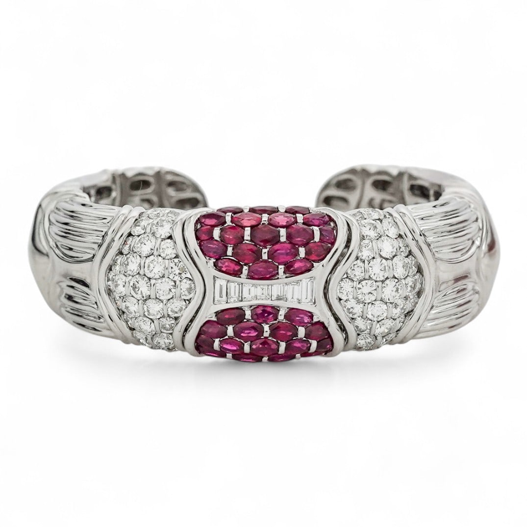 Italian 18k Gold Pigeon Ruby & Diamond Bangle Bracelet: Italian 18k Gold Pigeon Ruby & Diamond Bangle Bracelet 1980s-1990s, Italian 18k white gold hinged bangle bracelet set with marquise-cut, pigeon blood rubies weighing approximately 4.35 carats total, f