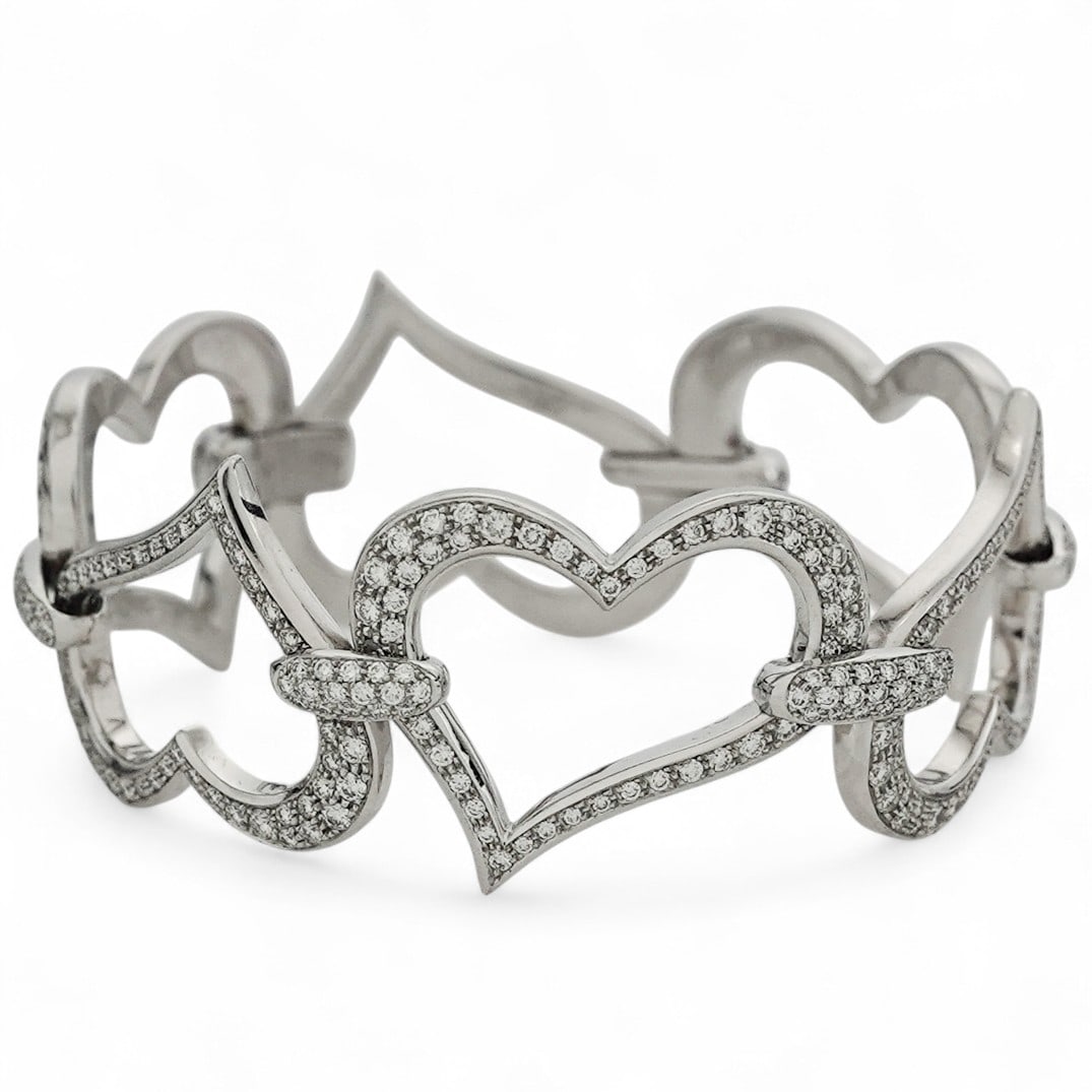 Piaget 18k Gold Diamond Pavé Heart Link Bracelet: Piaget 18k Gold Diamond Pavé Heart Link Bracelet 2000s-2010s, Swiss Piaget 18k white gold articulated heart link bracelet set with round brilliant-cut diamonds weighing approximately 4.71 carats tota