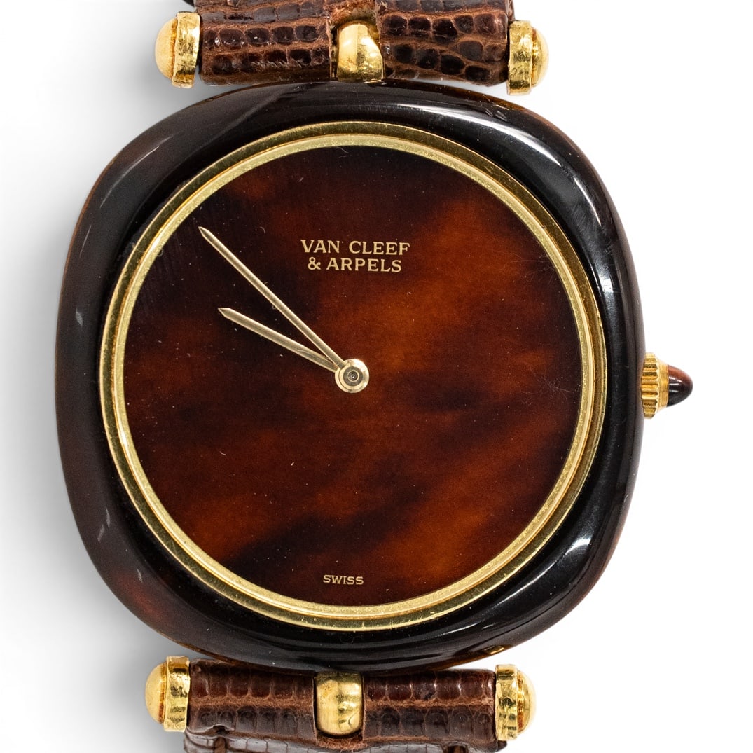 Vintage Van Cleef Arpels 18k Gold & Tortoise Hued Watch: Vintage Van Cleef Arpels 18k Gold & Tortoise Hued Watch designed by Gerald Genta. Features a manual winding movement, Tortoise style dial, gold hands, with a tortoise hued bezel, mineral crystal. The 
