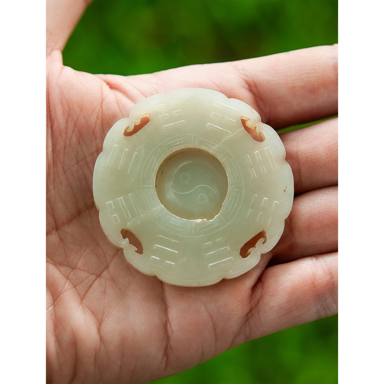 19th Cent. Jade Pendant With Rotating Center: 19th Cent. Jade Pendant With Rotating Center 19th Cent, China 19th-century carved jade pendant featuring an intricately pierced design with a rotating center element. Elegant craftsmanship with