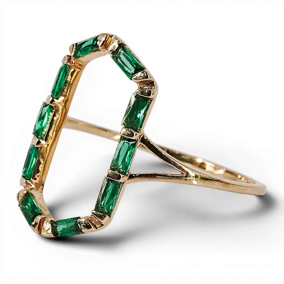 14k Gold & Emerald Open Frame Ring, Signed: 14k Gold & Emerald Open Frame Ring, Signed Late 20th Century Modern 14k yellow gold statement ring, designed as an elongated open octagonal frame channel-set throughout with twelve baguette-cut