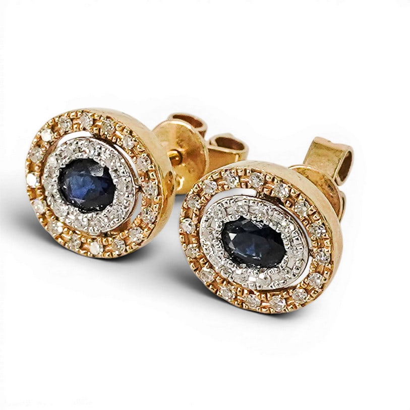 Schira Bros. 14k Gold Sapphire & Diamond Halo Stud Earrings: Schira Bros. 14k Gold Sapphire & Diamond Halo Stud Earrings Mid-Late 20th Century, USA Pair of 14k yellow and white gold stud earrings by Schira Bros. each centered with oval faceted blue sapphires