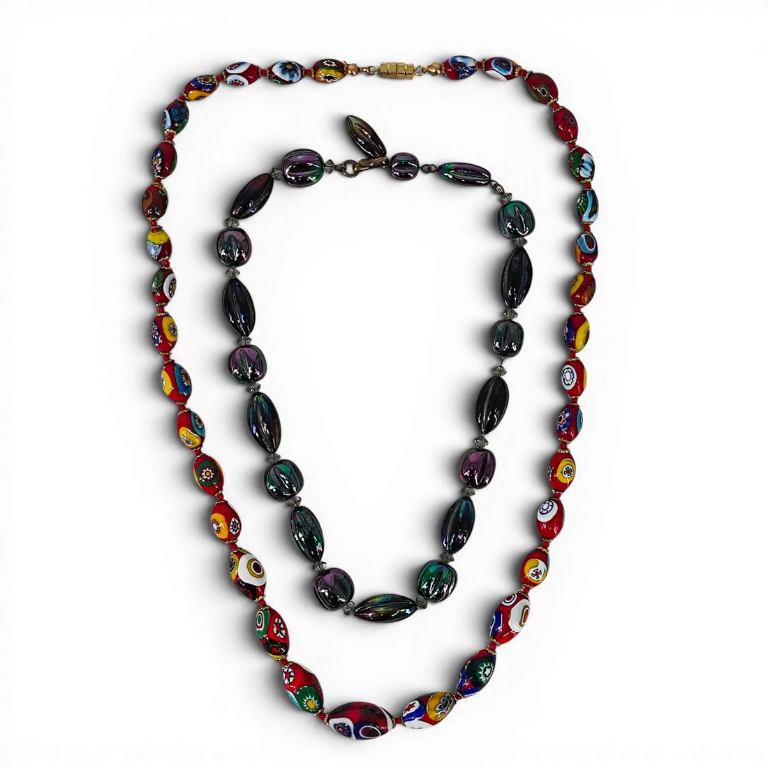 (2 pc) Vintage Millefiori Murano & Iridescent Art Glass Beaded Necklaces: (2 pc) Vintage Millefiori Murano & Iridescent Art Glass Beaded Necklaces Mid-20th Century, Italy Italian millefiori Murano glass beaded necklace together with an iridescent peacock carnival glass