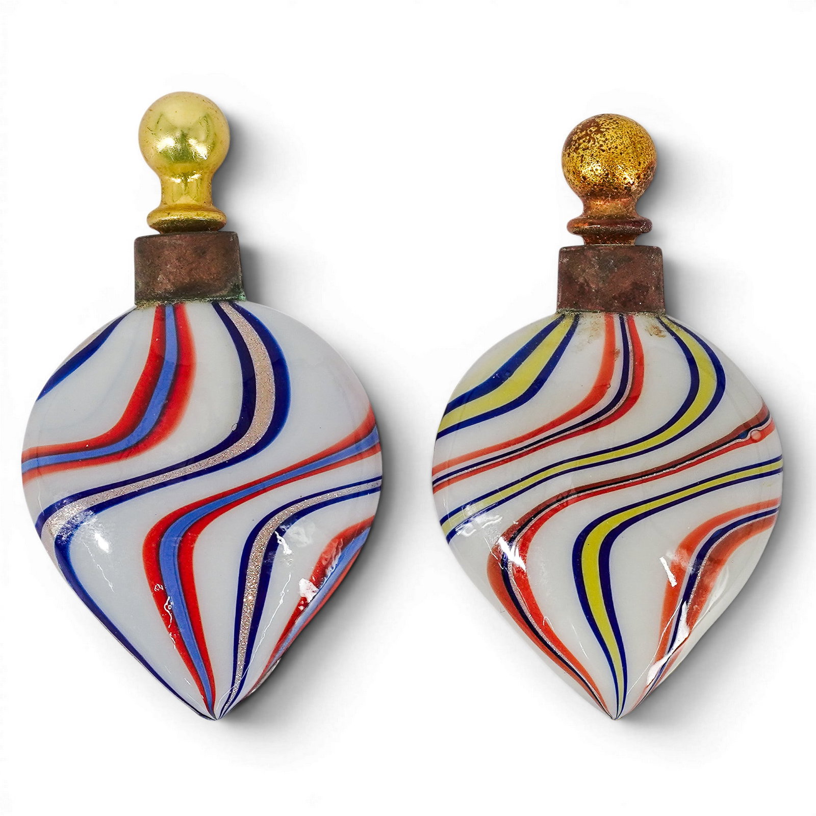 Pair of Vintage Murano Glass Perfume Bottles: Pair of Vintage Murano Glass Perfume Bottles Mid-20th Century, Italy Pair of vintage Murano glass perfume bottles featuring teardrop-form bodies with swirling red, white, and blue ribbon decoration.