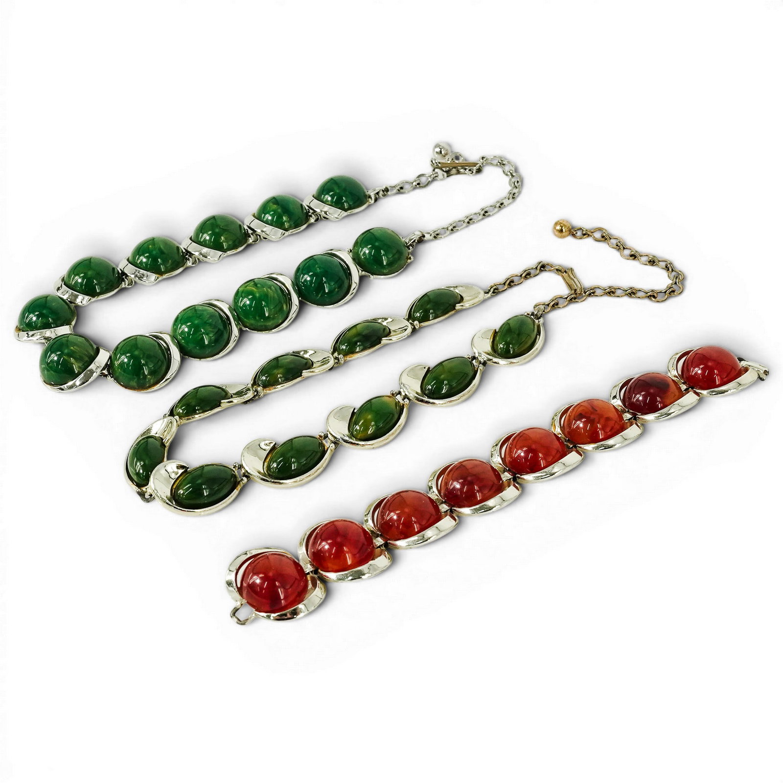 (3 Pcs) Vintage Bakelite Cabochon Necklaces & Bracelet: (3 Pcs) Vintage Bakelite Cabochon Necklaces & Bracelet Mid-20th Century, USA Lot of three vintage Bakelite-style phenolic resin cabochon pieces in silver-tone base metal mounts, comprising: (1) a
