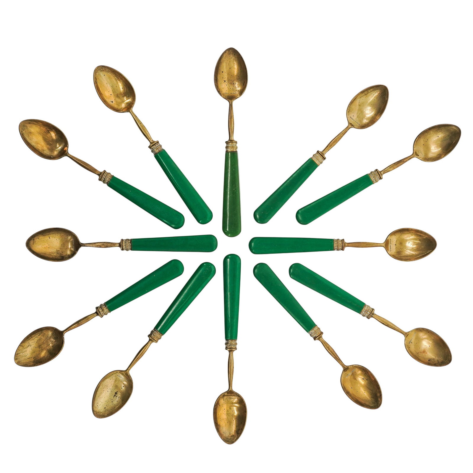(12 pc) Antique Higgs of France Brass & Green Celluloid Handle: (12 pc) Antique Higgs of France Brass & Green Celluloid Handle Late 19th Century, France Each features a brass spoon bowl and green tapered celluloid handle with decorative brass and white enamel