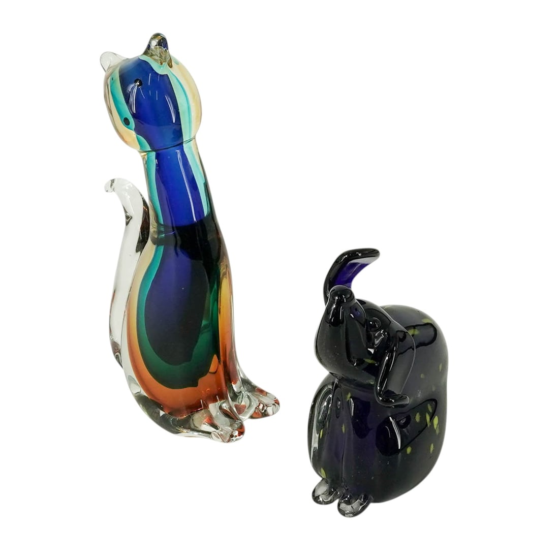 (2 pcs) Murano Glass Cat & Dog: (2 pcs) Murano Glass Cat & Dog Mid to late 20th century, Italian A Murano glass cat and dog sculpture. (1) Dog, cobalt blue with yellow speckles. Marked on bottom with Murano label. H 6.5" x L 5.25" x