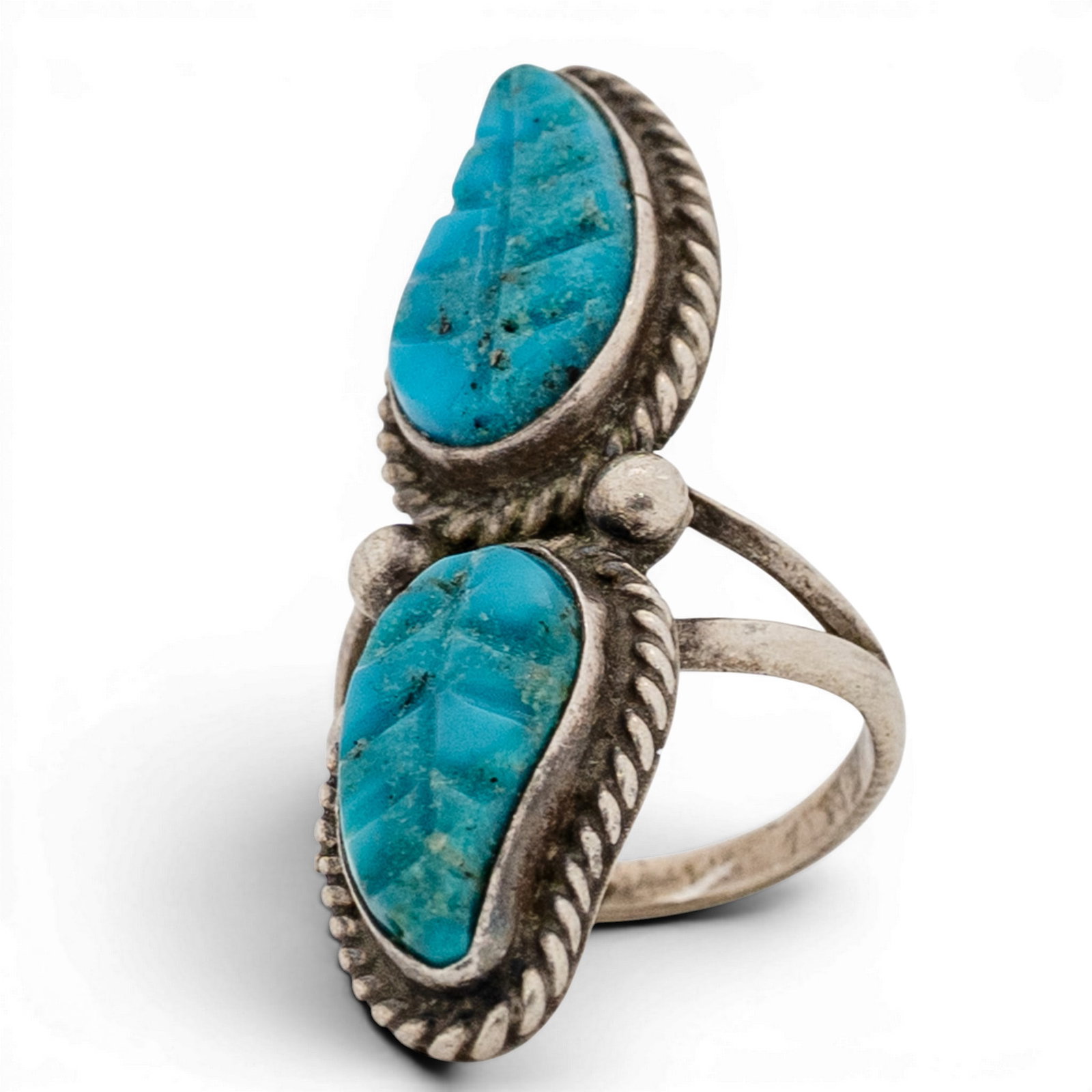 Vintage Navajo Sterling Silver & Carved Turquoise Leaf Ring: Vintage Navajo Sterling Silver & Carved Turquoise Leaf Ring 1970s-1980s, USA Vertical double-stone ring set with two carved turquoise cabochons, each bearing incised linear motifs. Stones are set in s